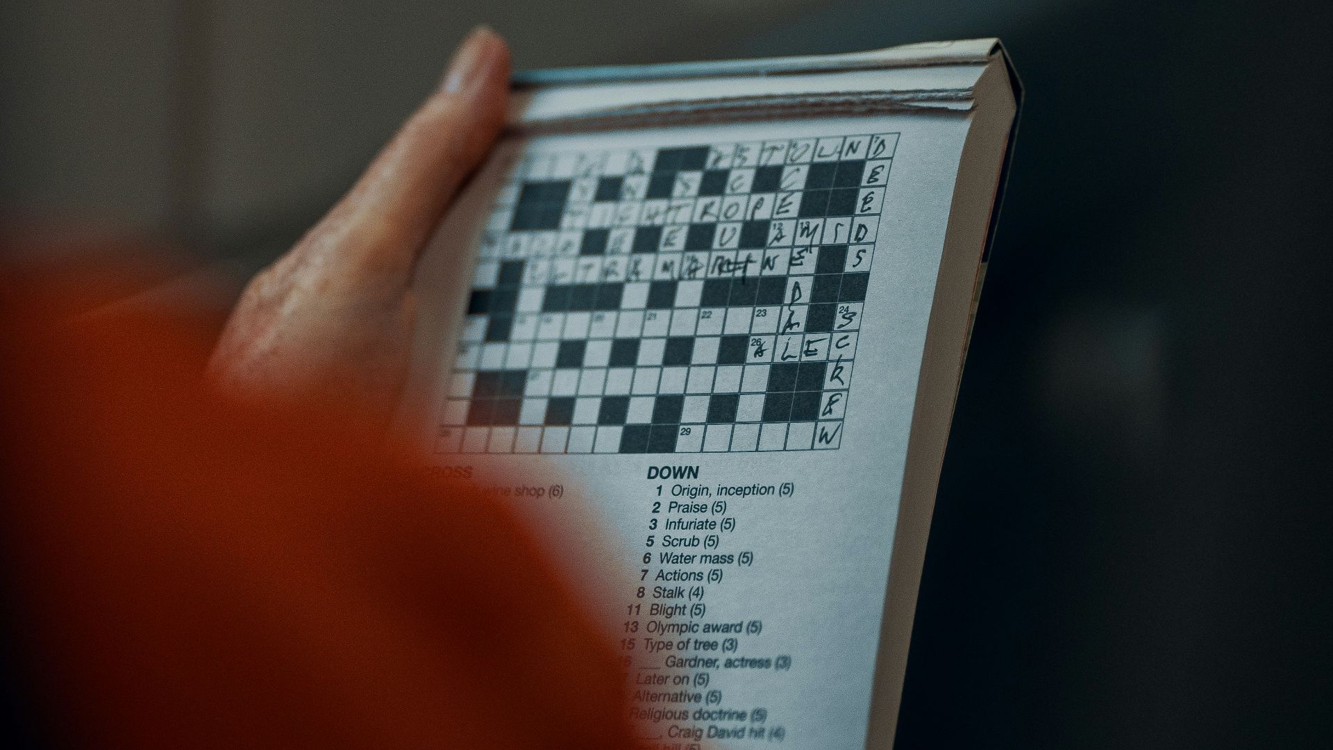 person holding white and black paper