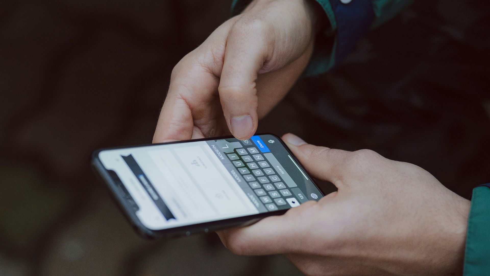 selective focus photography of person using smartphone