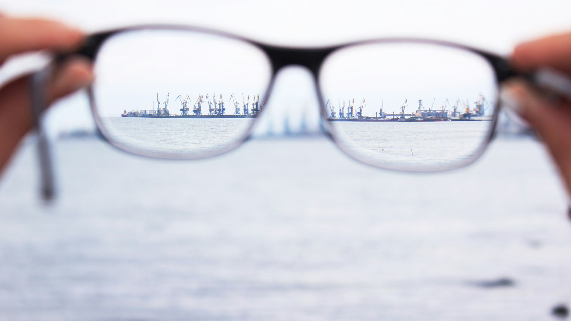 person holding eyeglasses