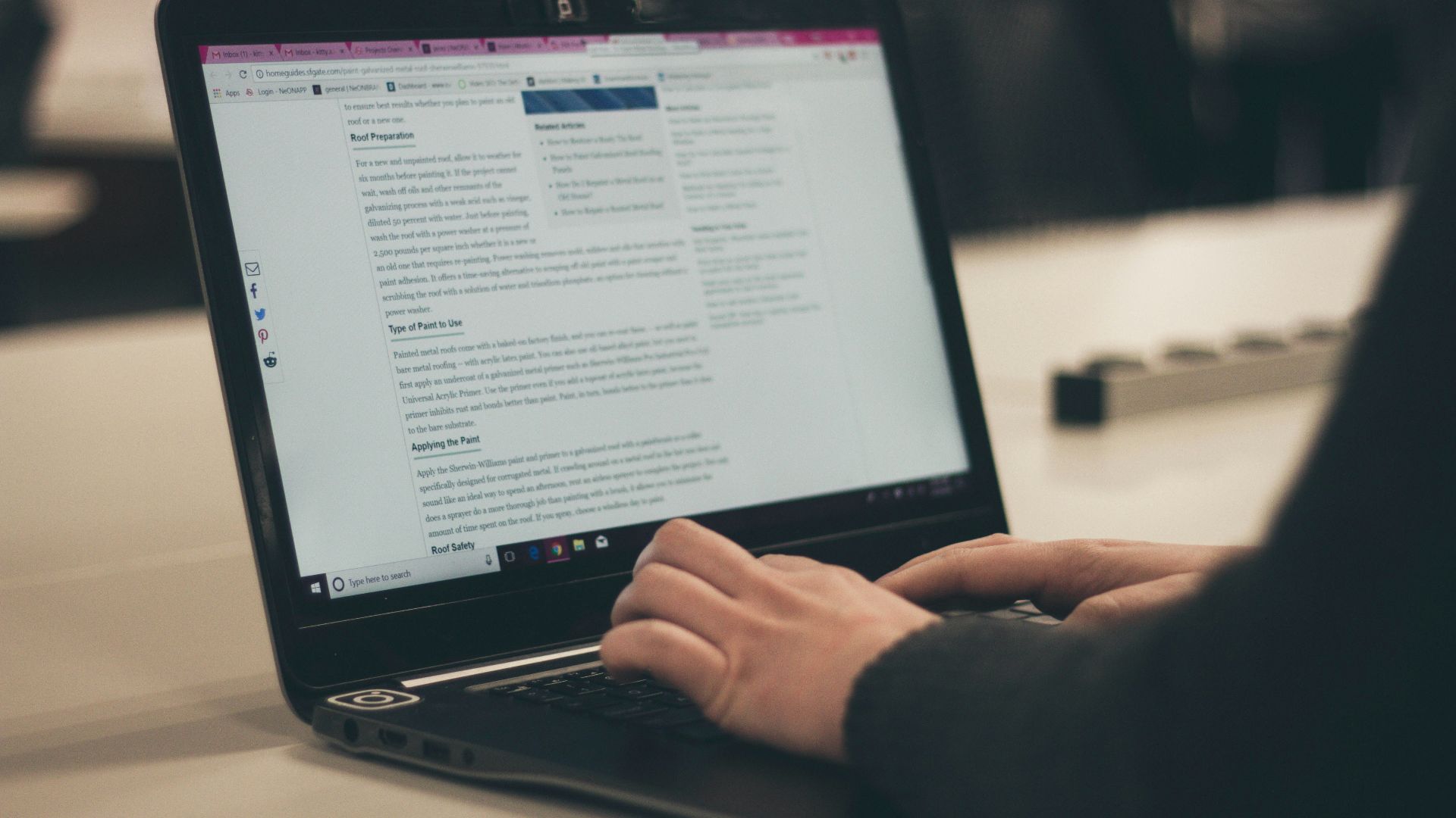 person typing on laptop computer