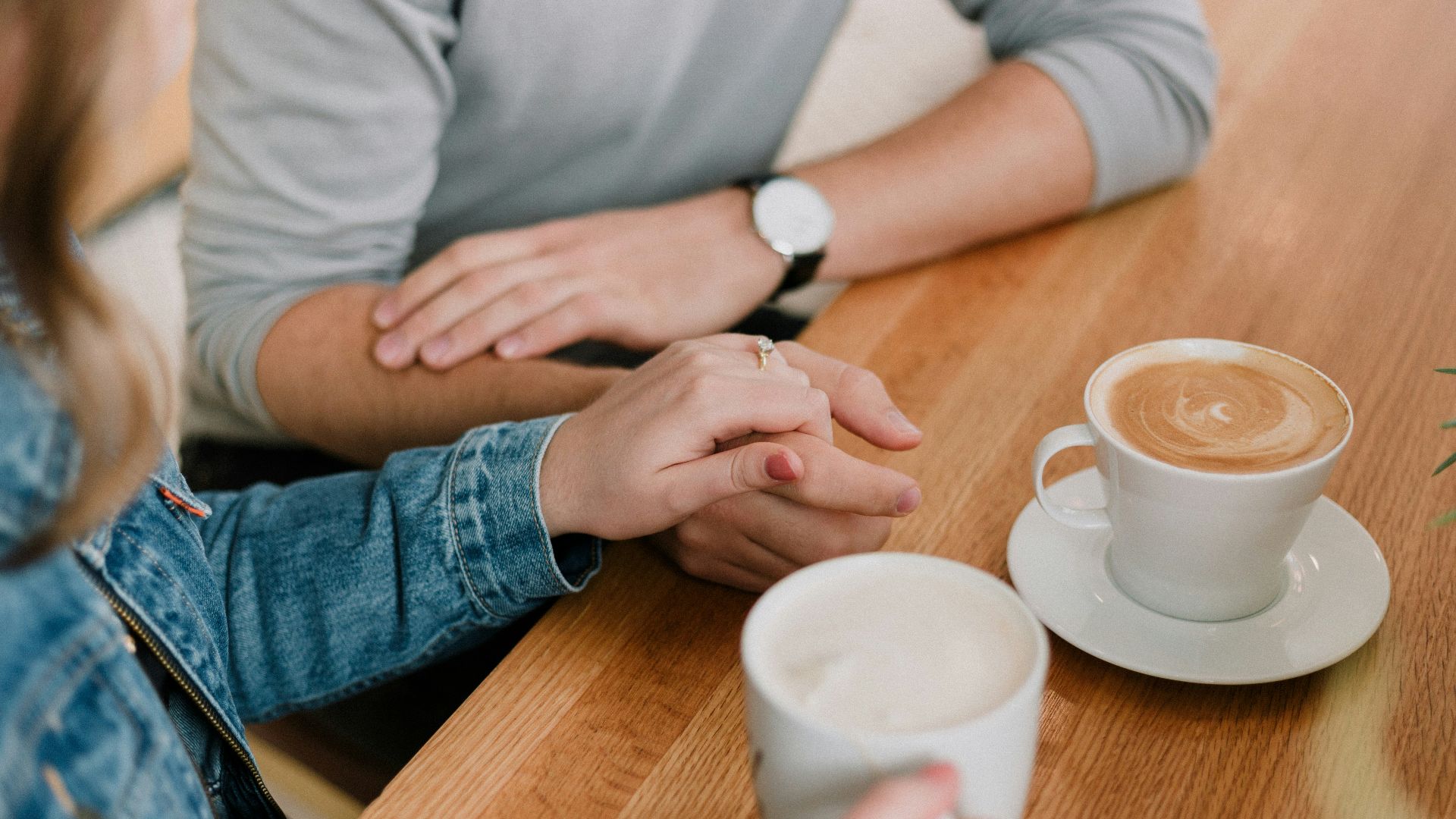 man and woman holding hands