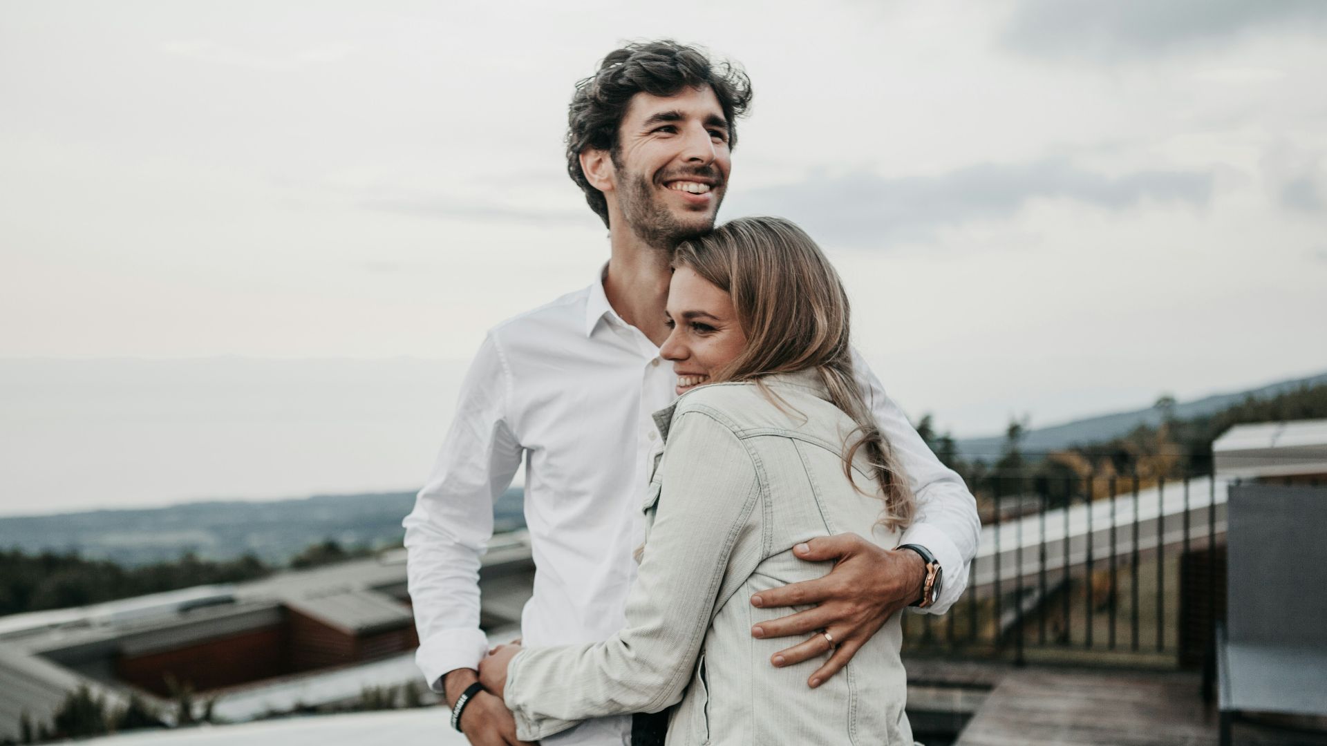 man and woman hugging each other