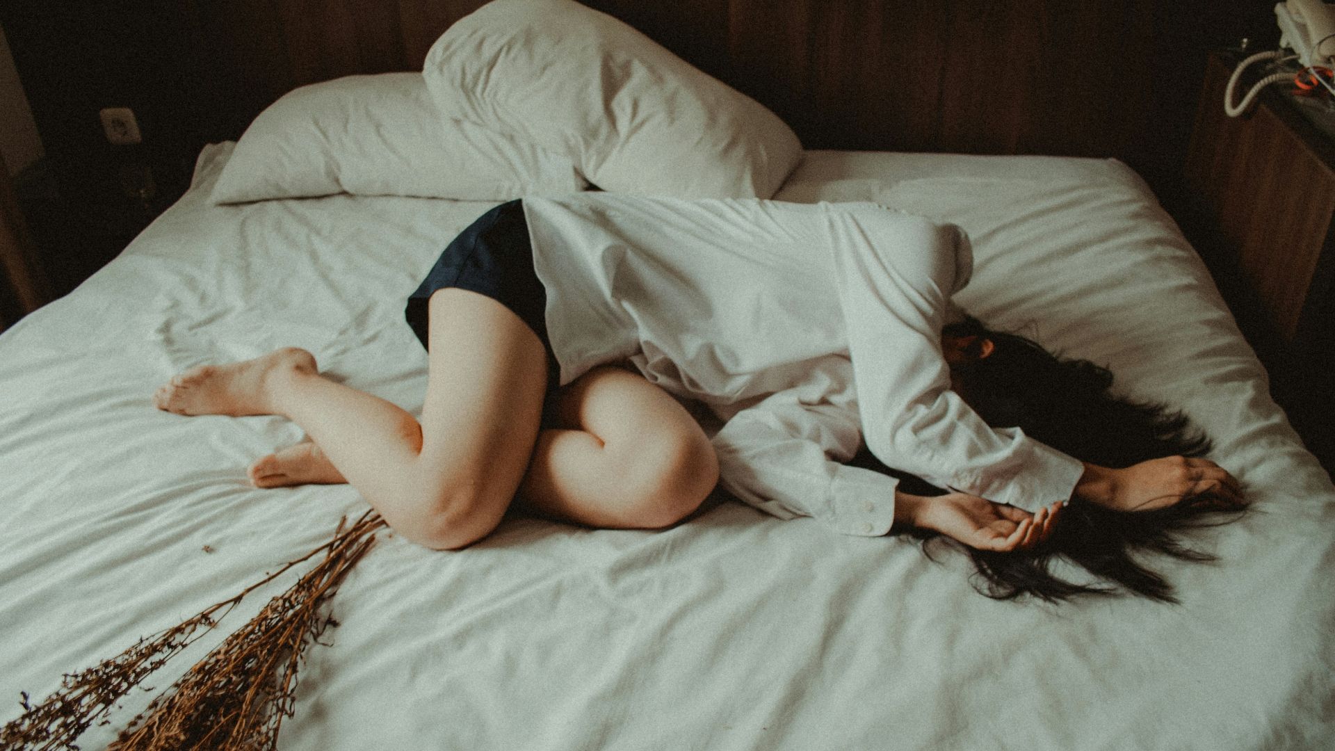 woman lying on bed