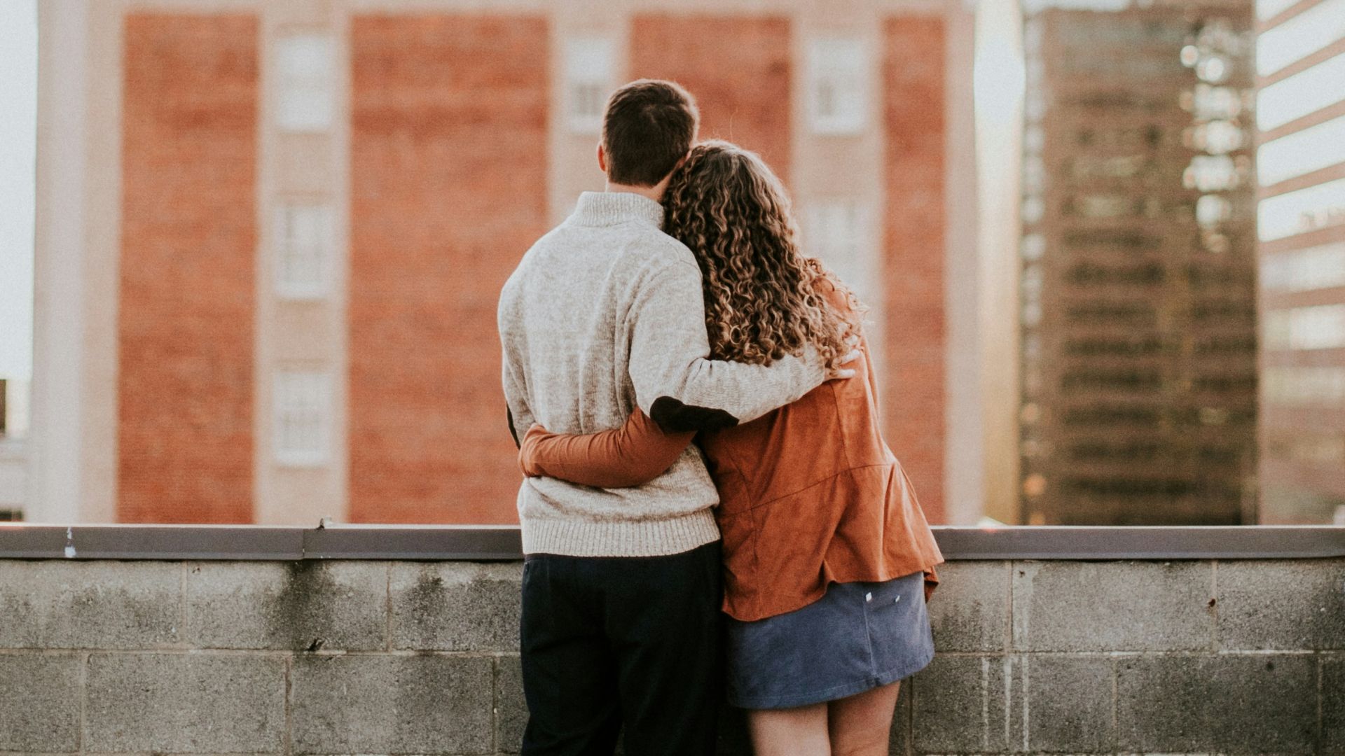 man and woman hugging each other