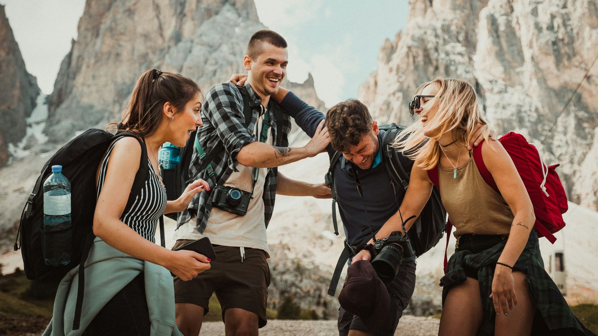 low-angle photography of two men playing beside two women
