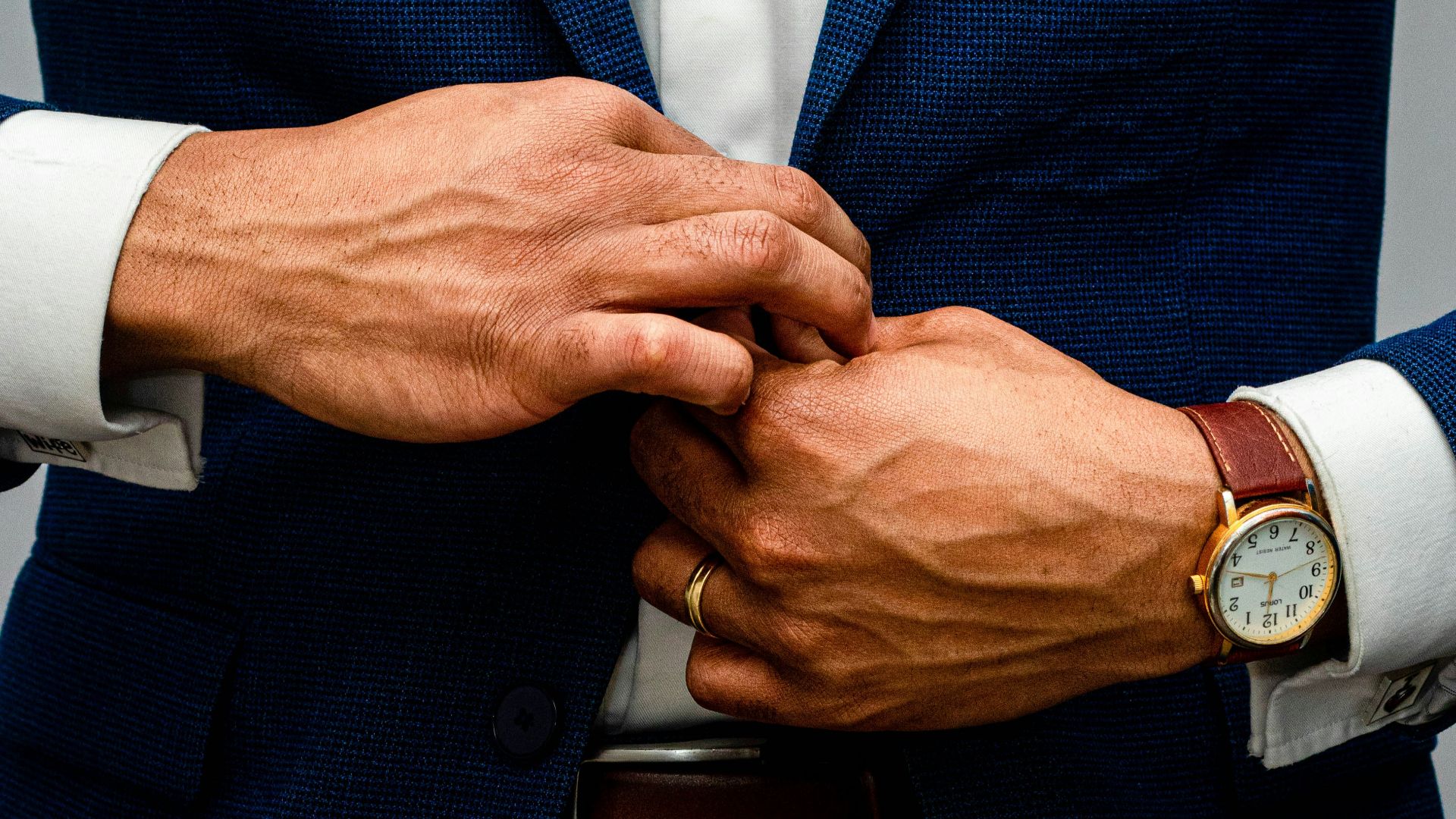 man in blue suit jacket and white dress shirt