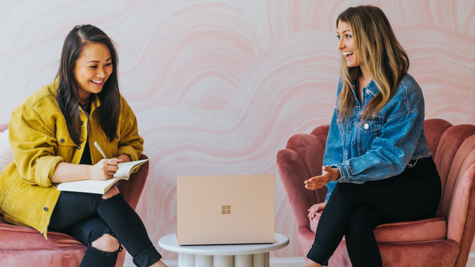 3 women sitting on chair