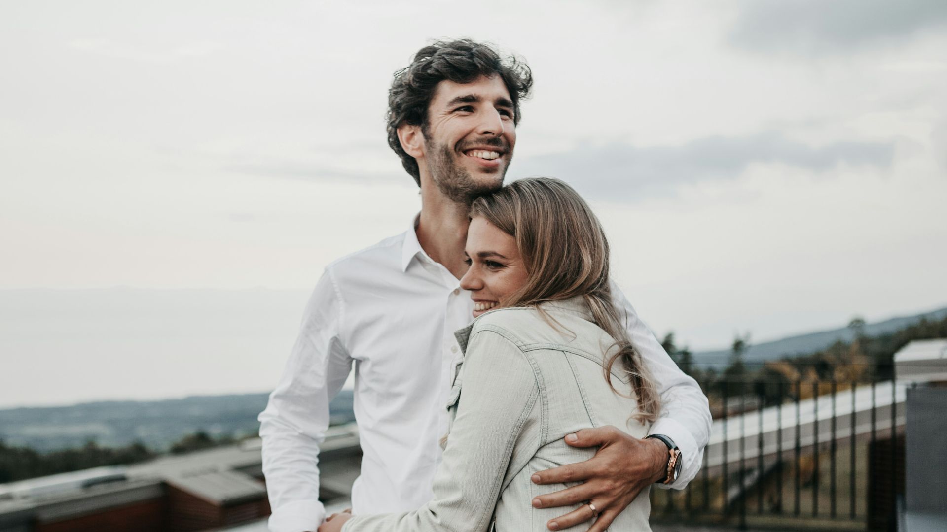 man and woman hugging each other