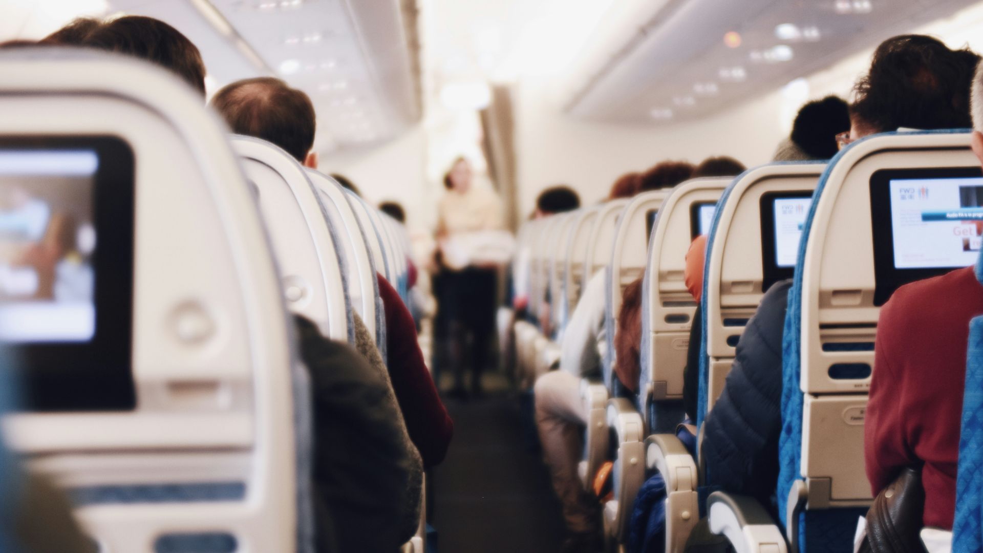 shallow focus photography of people inside of passenger plane