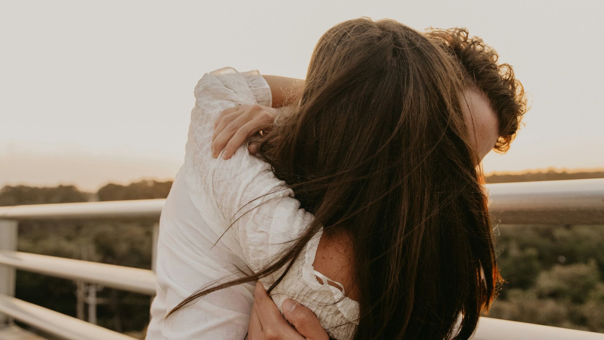 a man and woman kissing