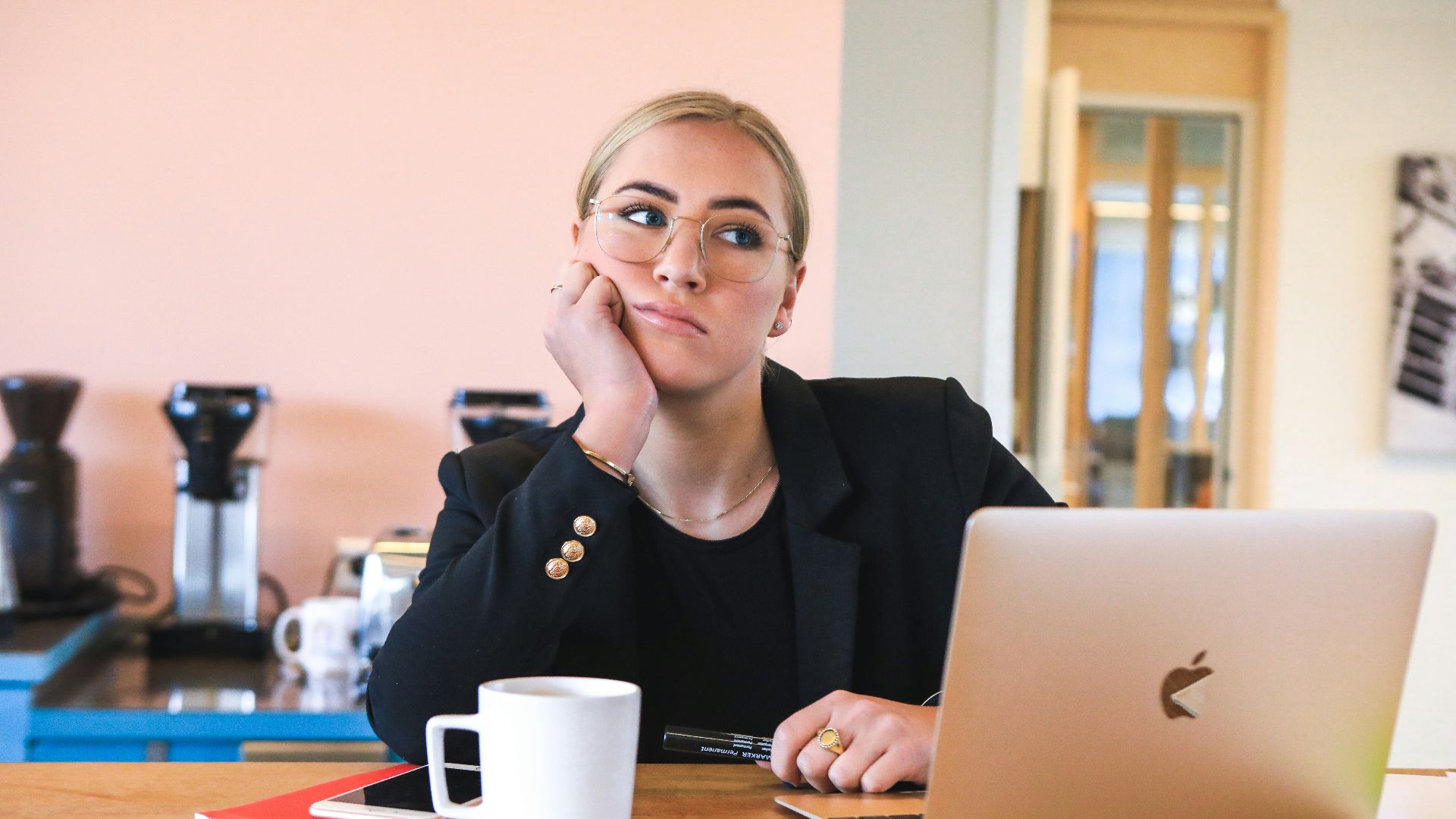 woman in black long sleeve shirt using macbook