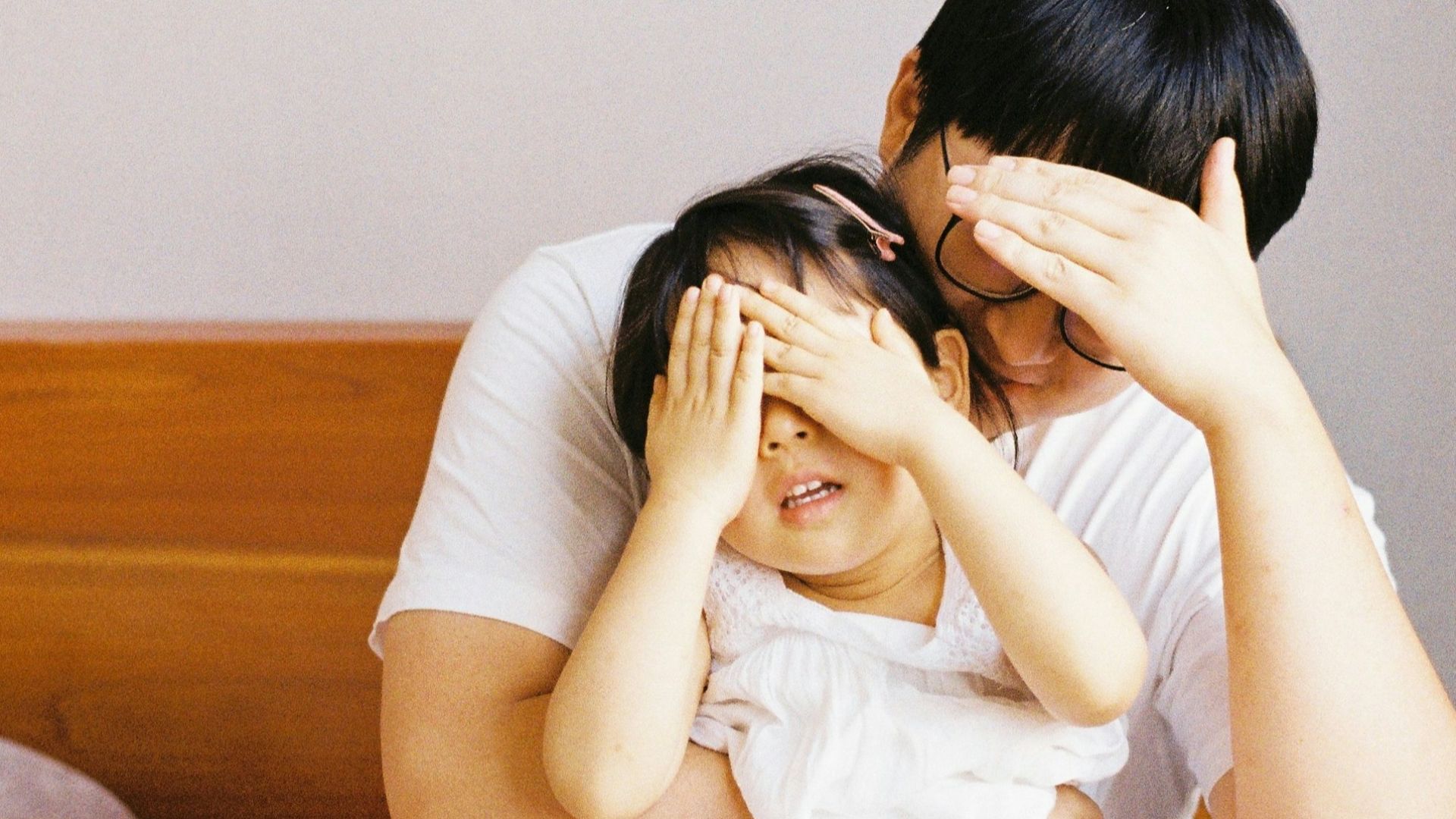 woman in white dress lying on bed