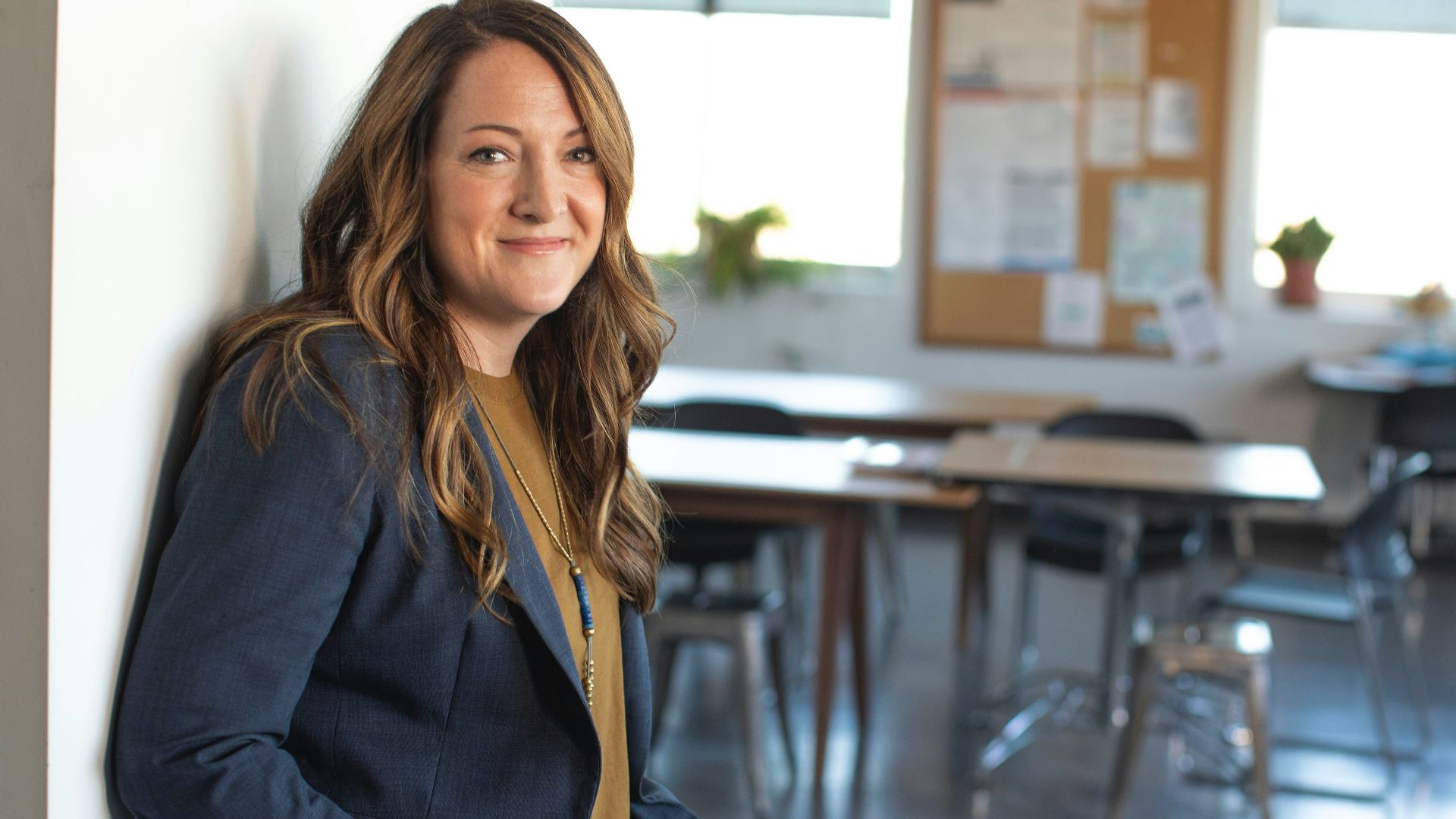 woman in black coat sitting on chair