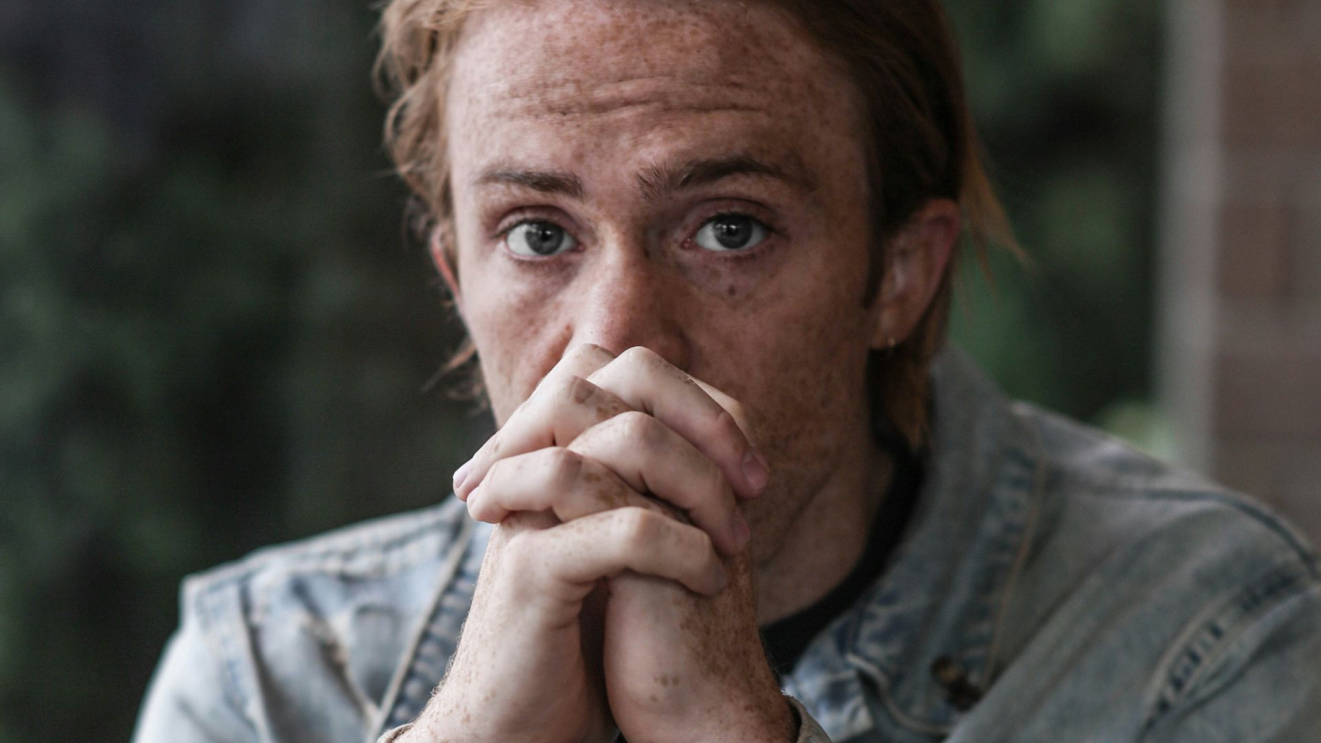 man in gray-washed denim jacket