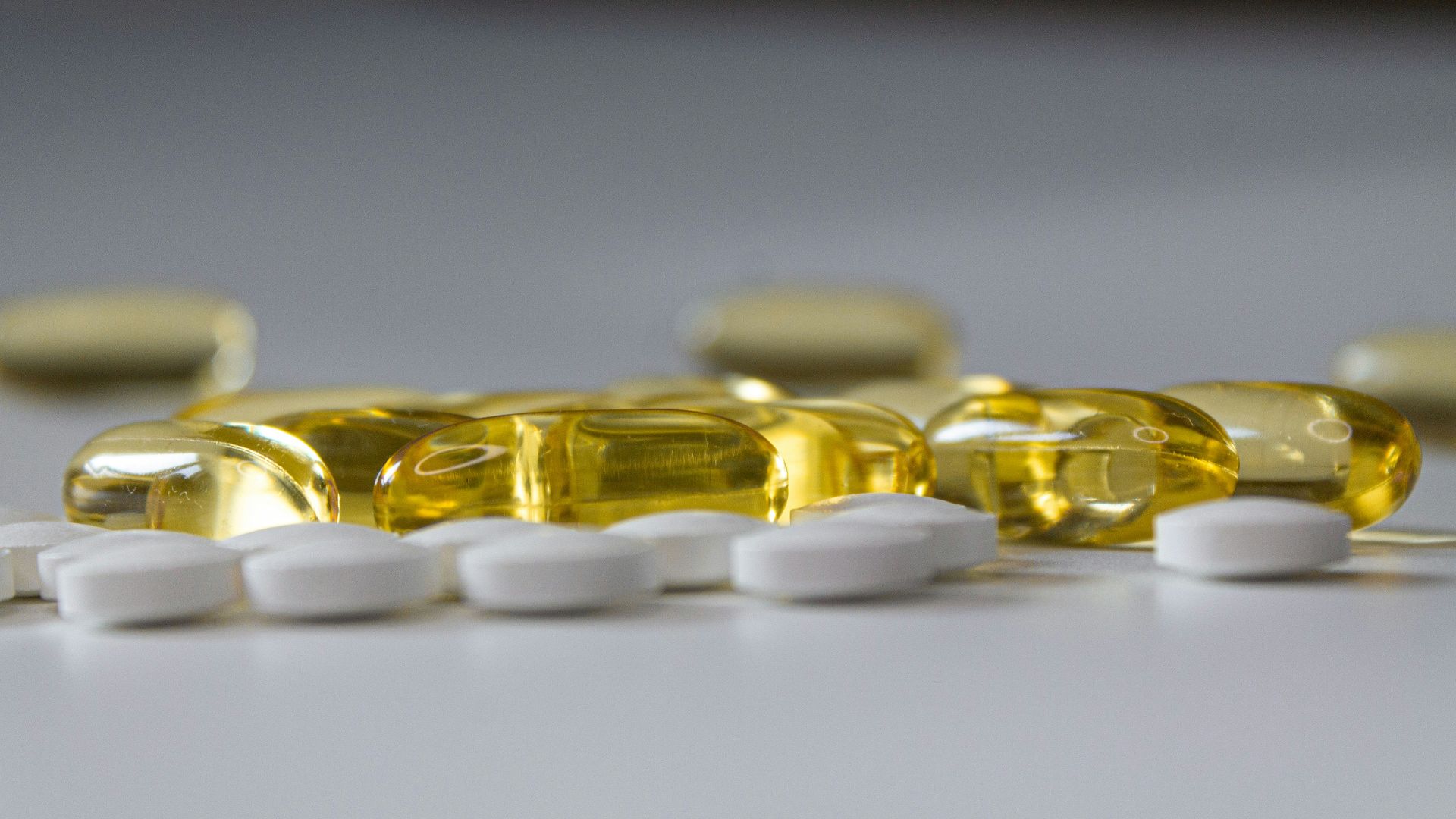 a close up of many pills on a table
