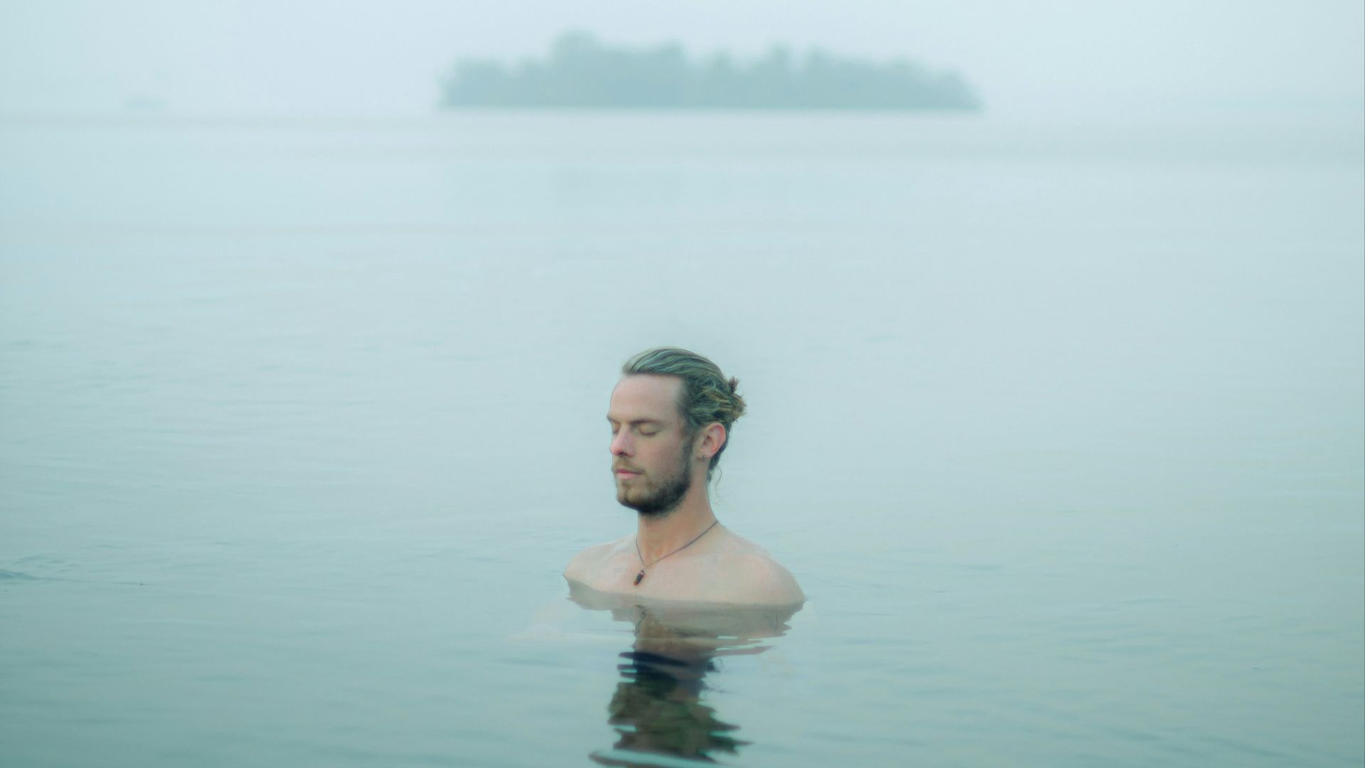 woman in black bikini top in water