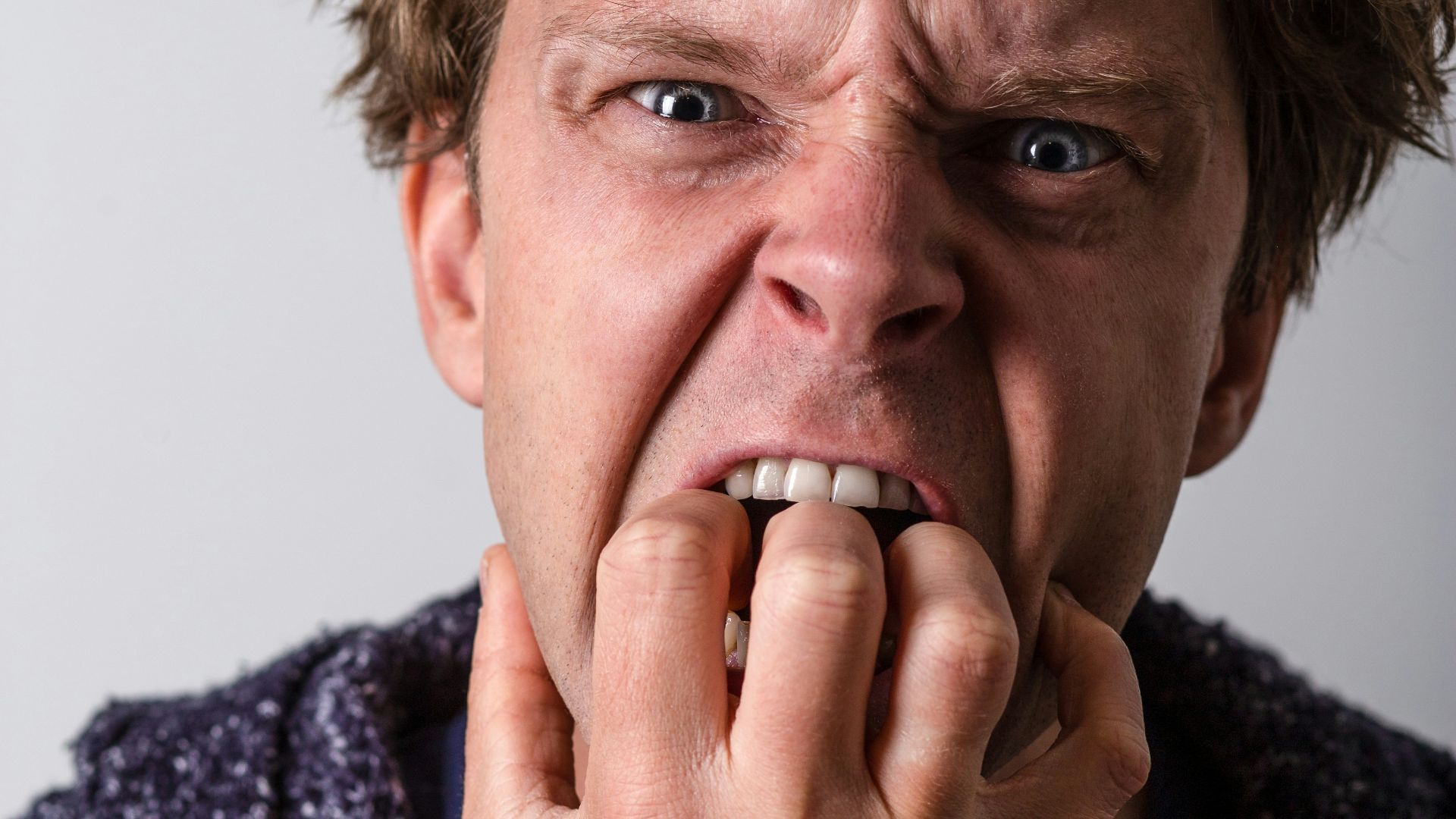 man in blue and white long sleeve shirt