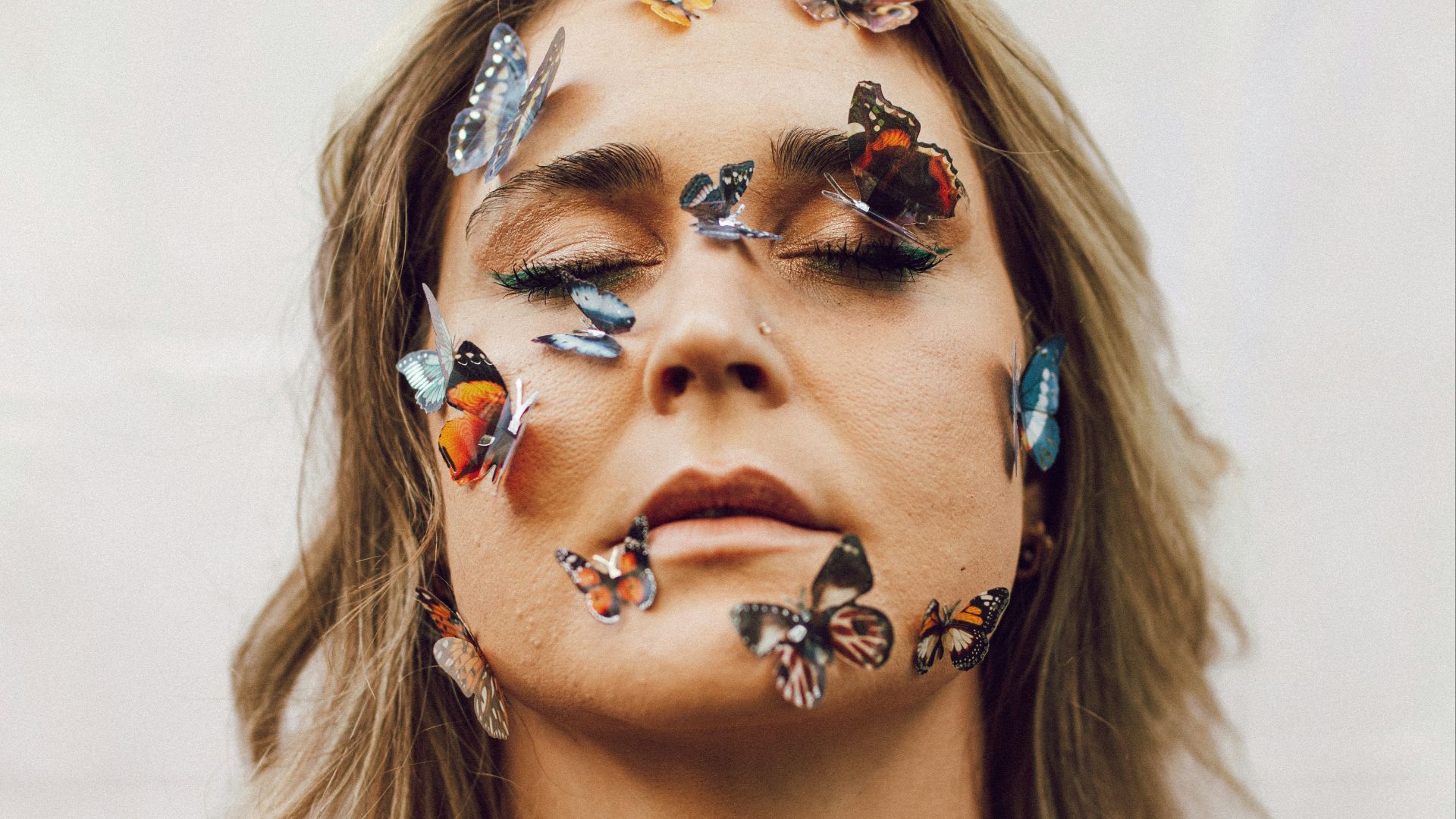 a woman with butterflies painted on her body