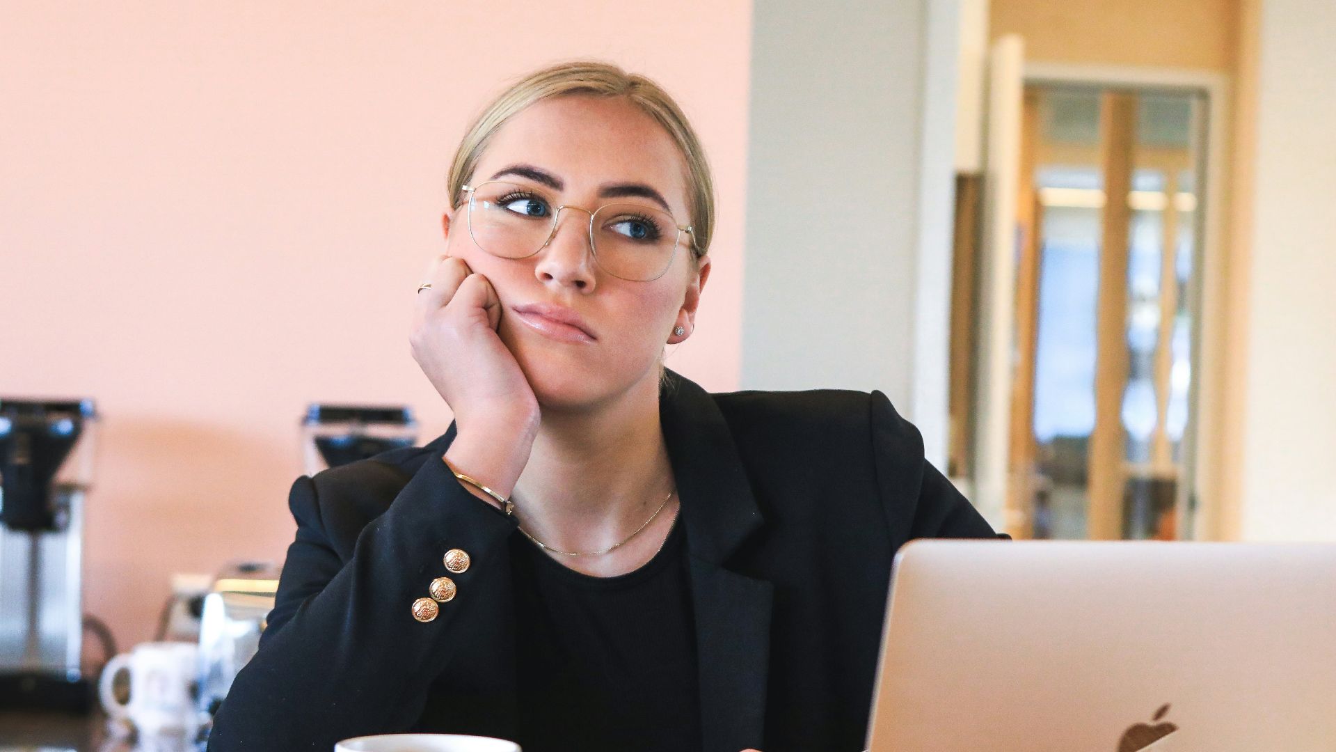 woman in black long sleeve shirt using macbook