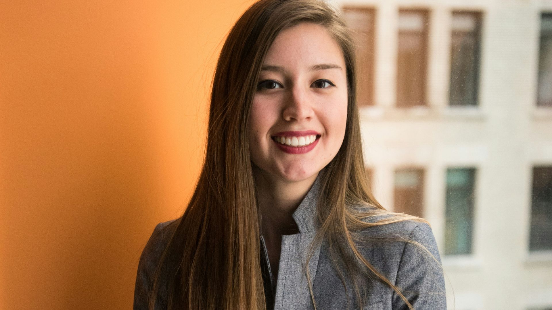 shallow focus photo of woman in gray jacket