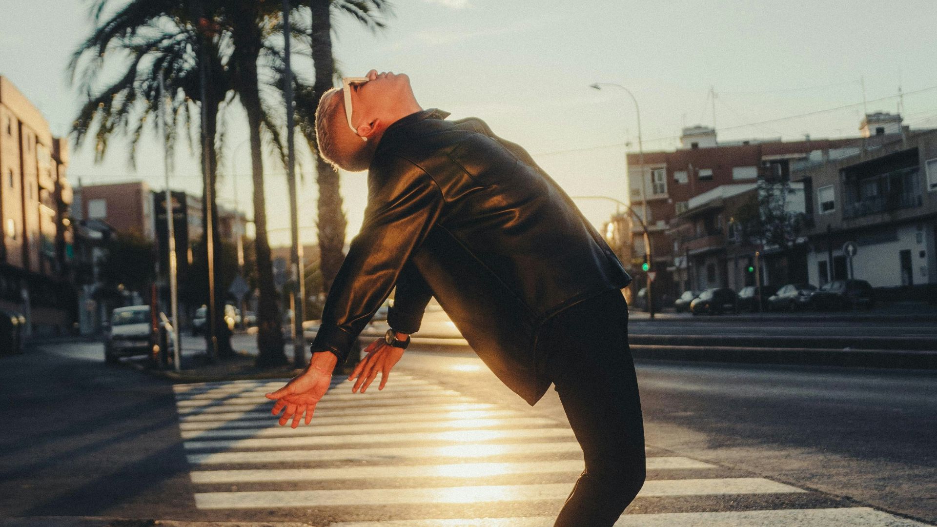 a man is doing a trick on the street