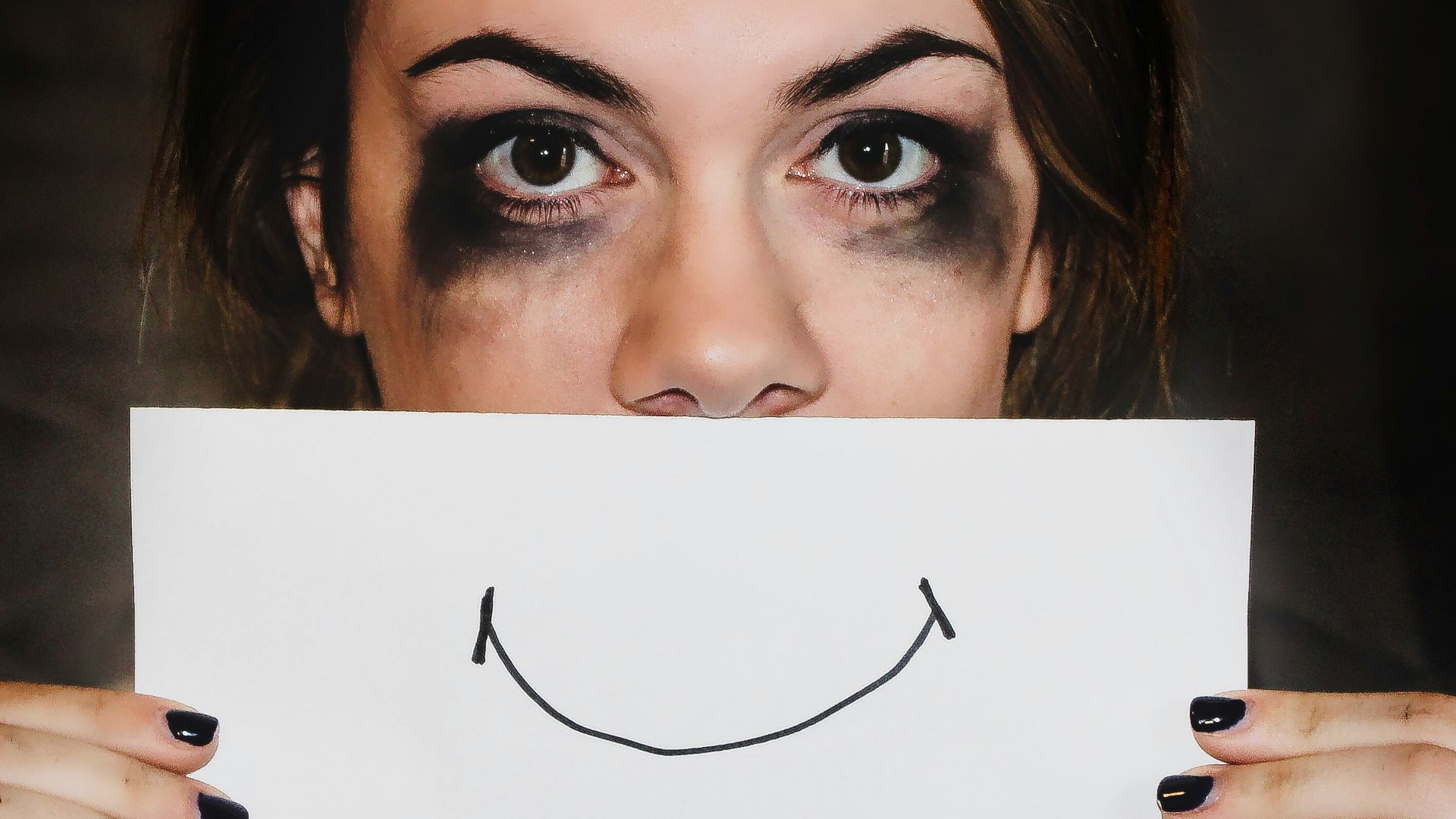 person holding white printer paper