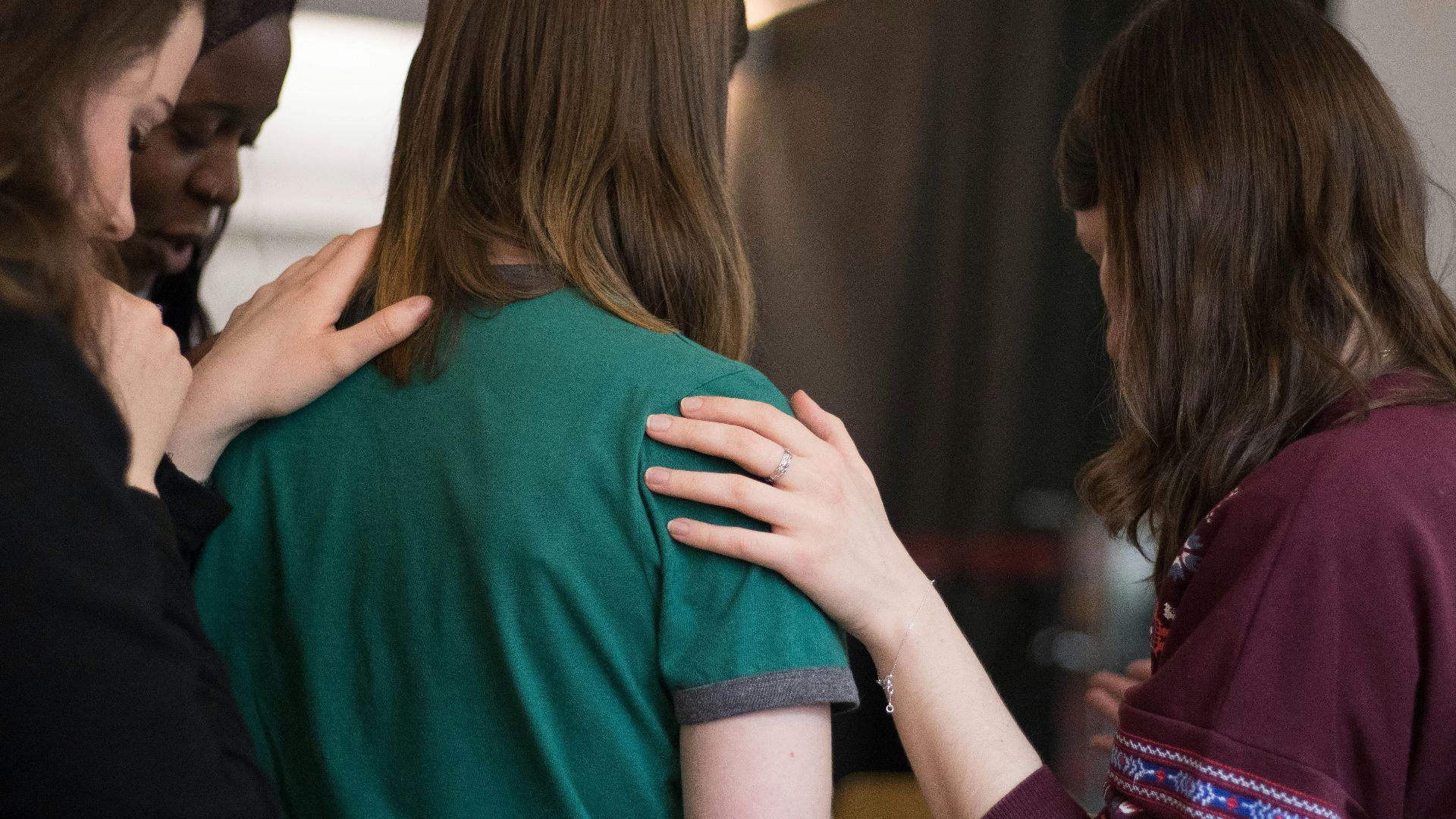 four women looking down