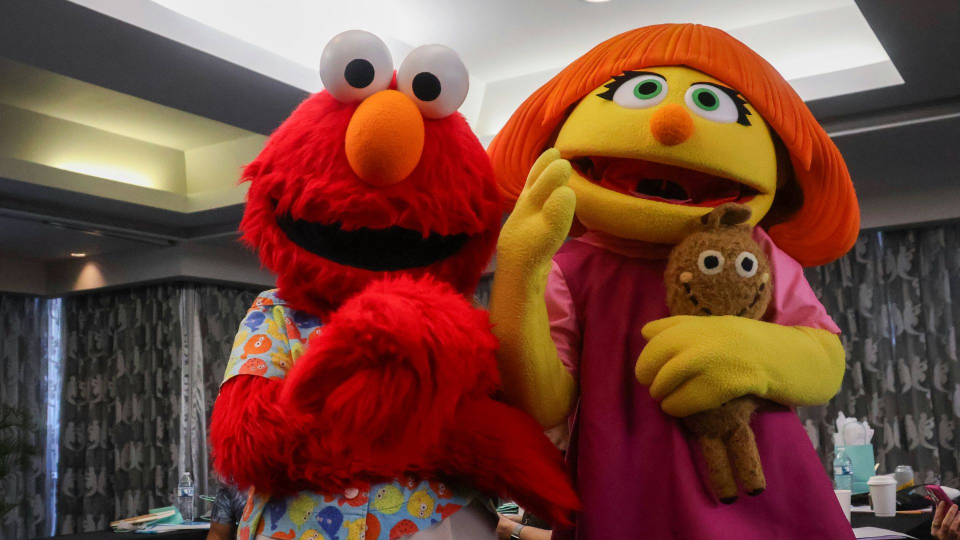 A couple of people standing next to each other