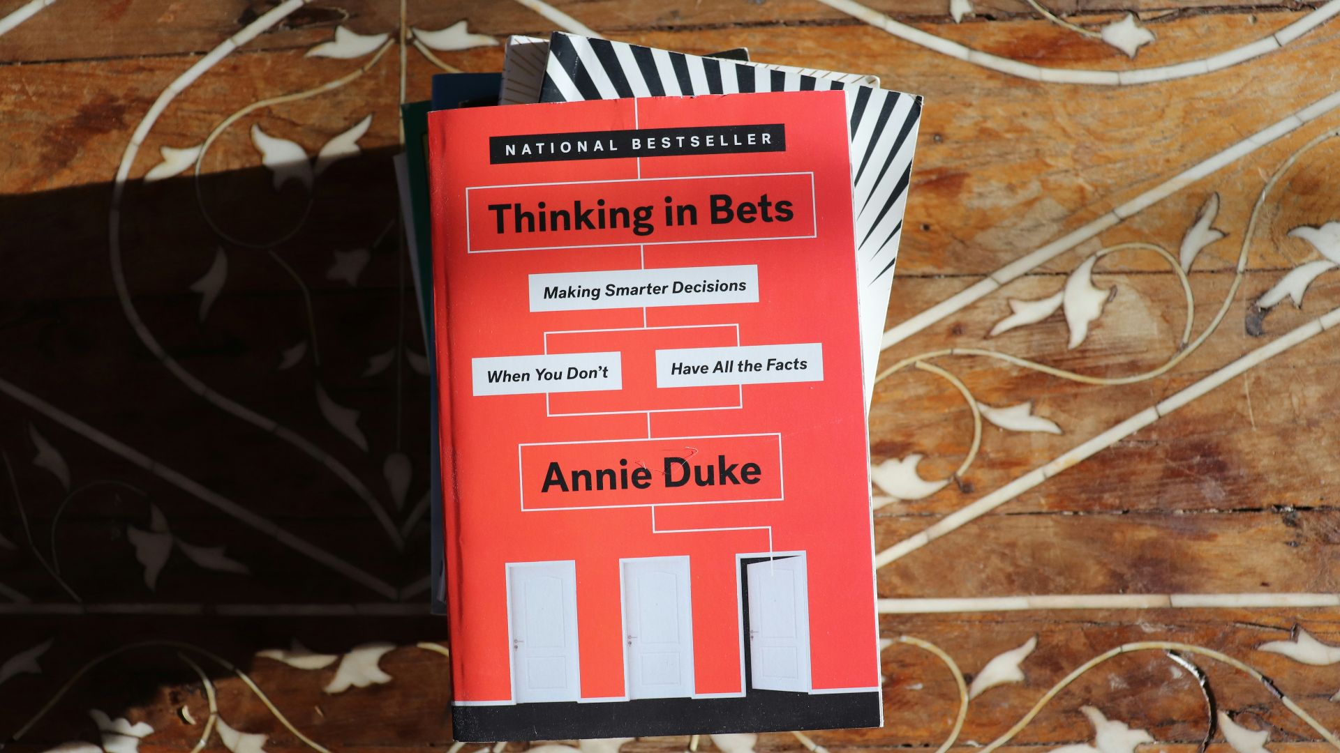 red and white book on brown leaves