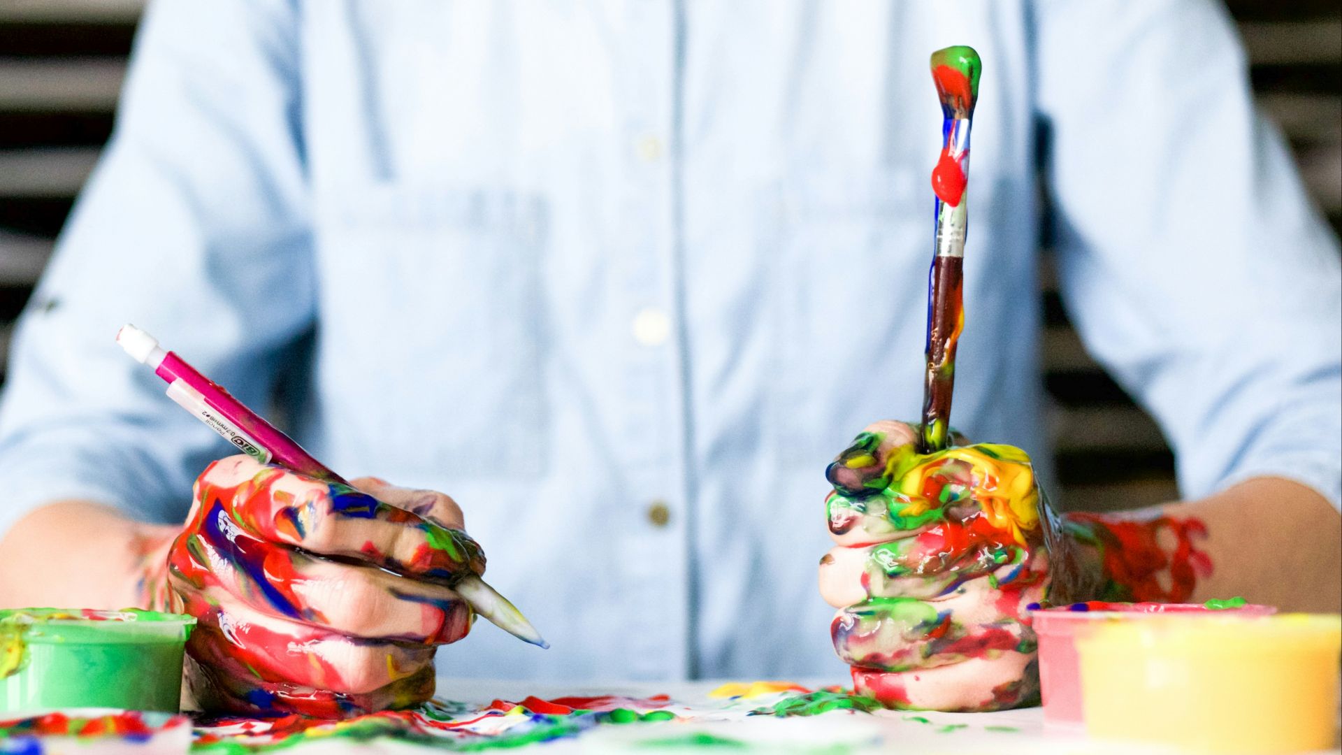 person holding click pen