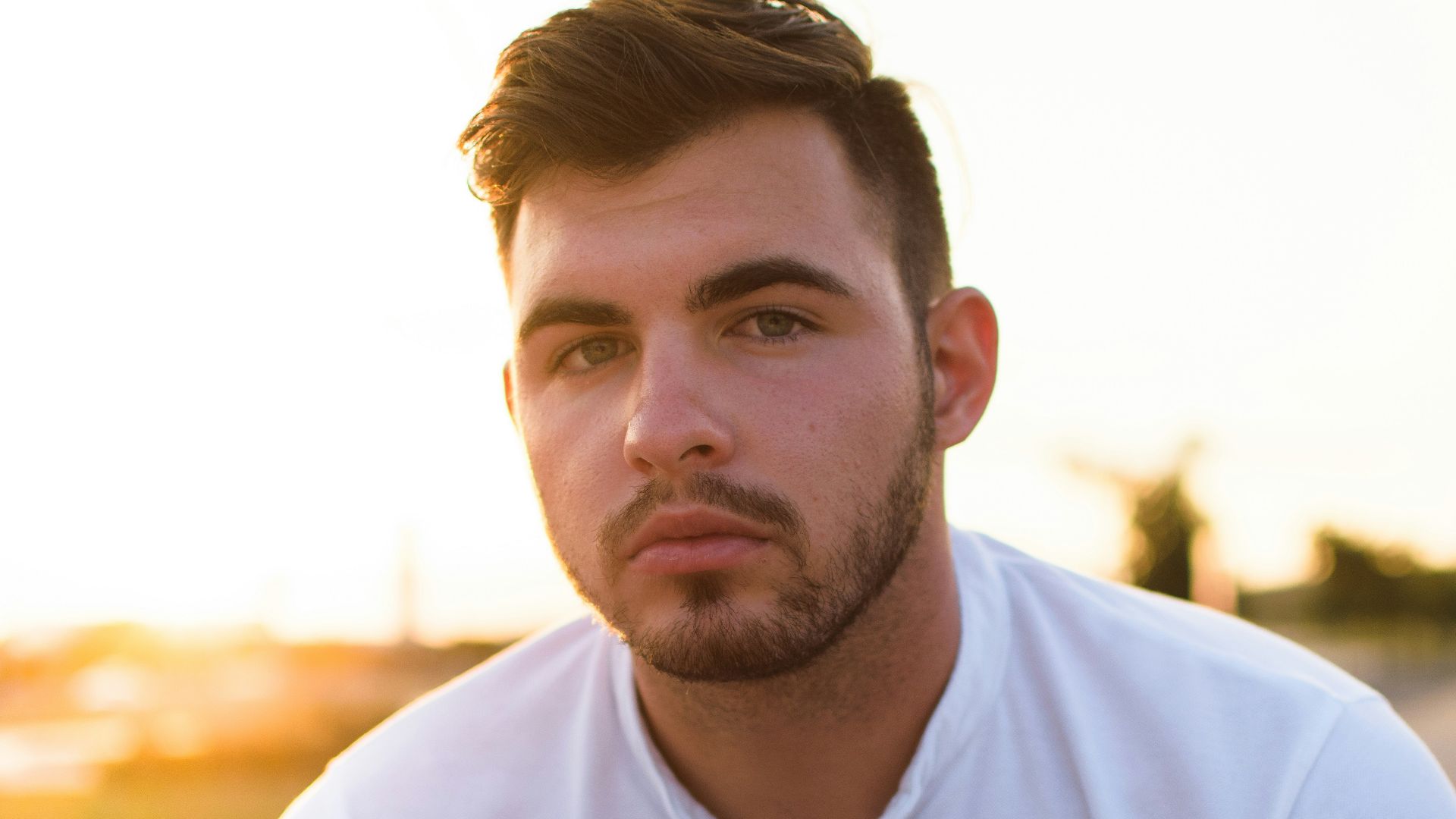 man showing poker face while taking him a picture