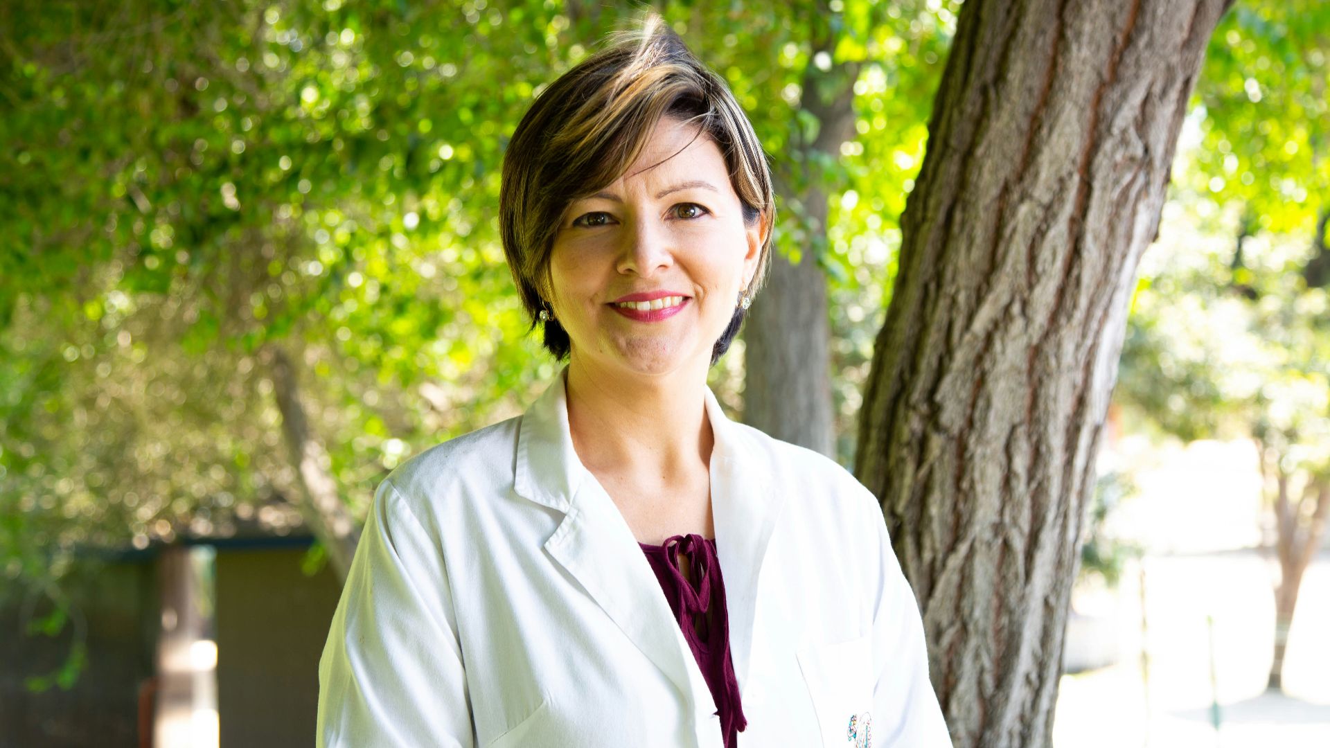 woman standing under tree