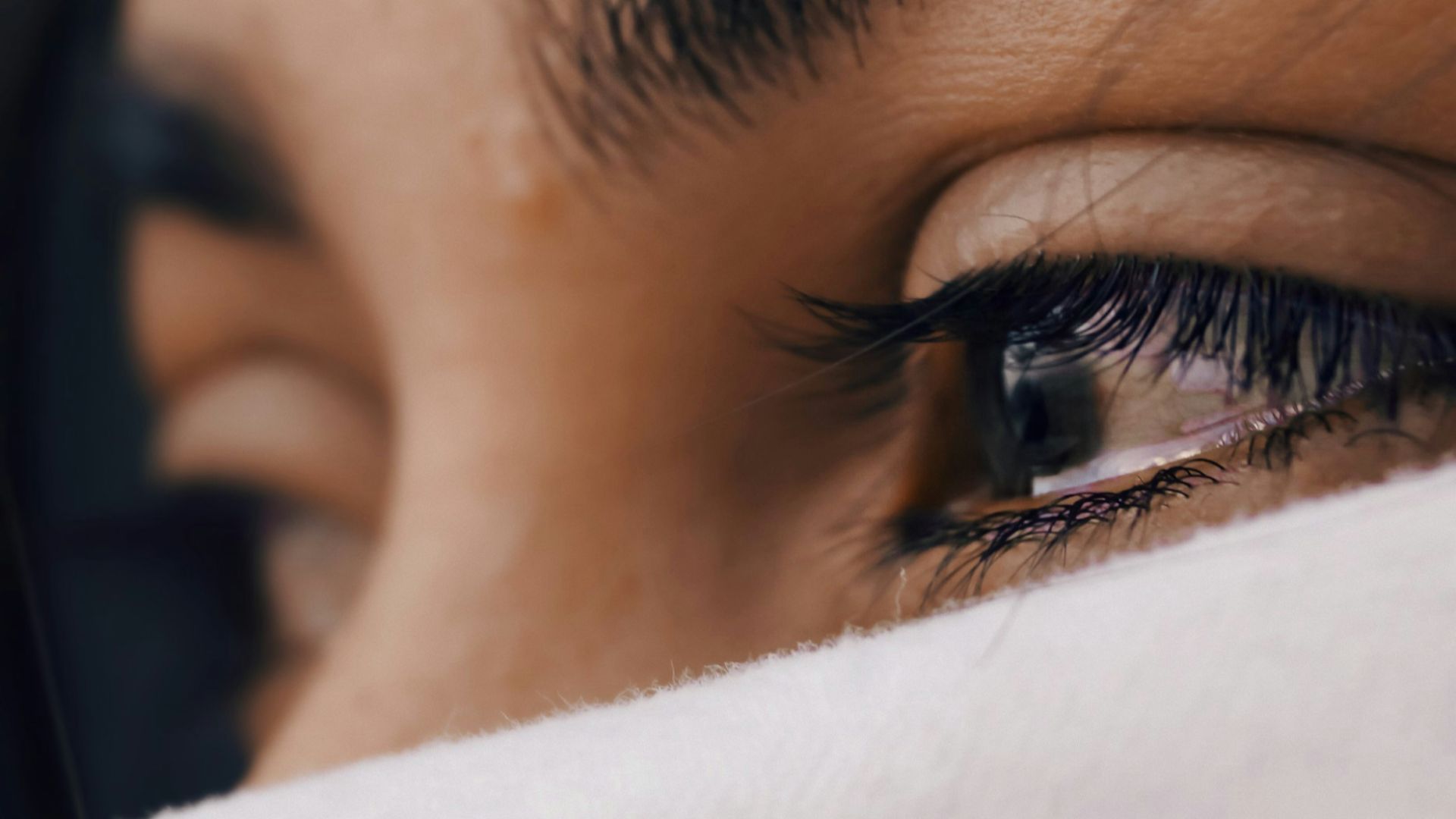 shallow focus of a woman's sad eyes