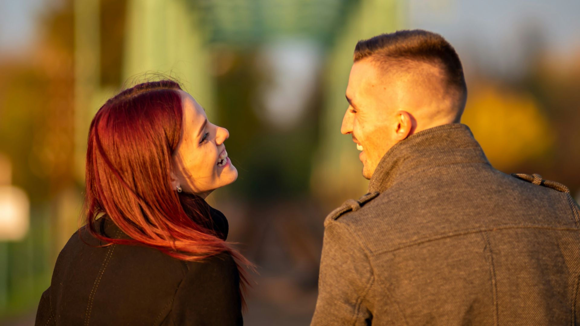 man and woman standing side by side during daytime