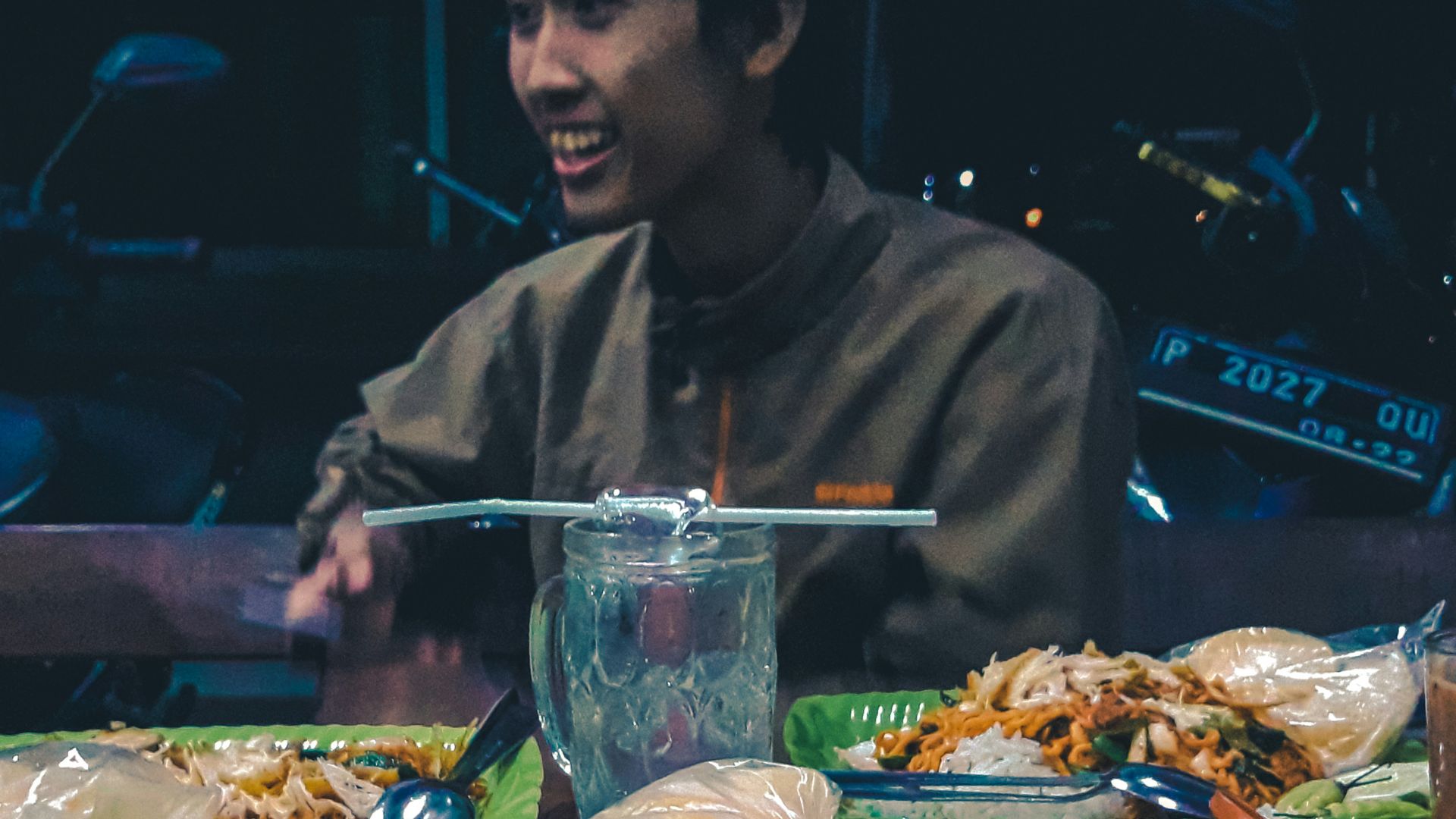 man beside beside plate of food