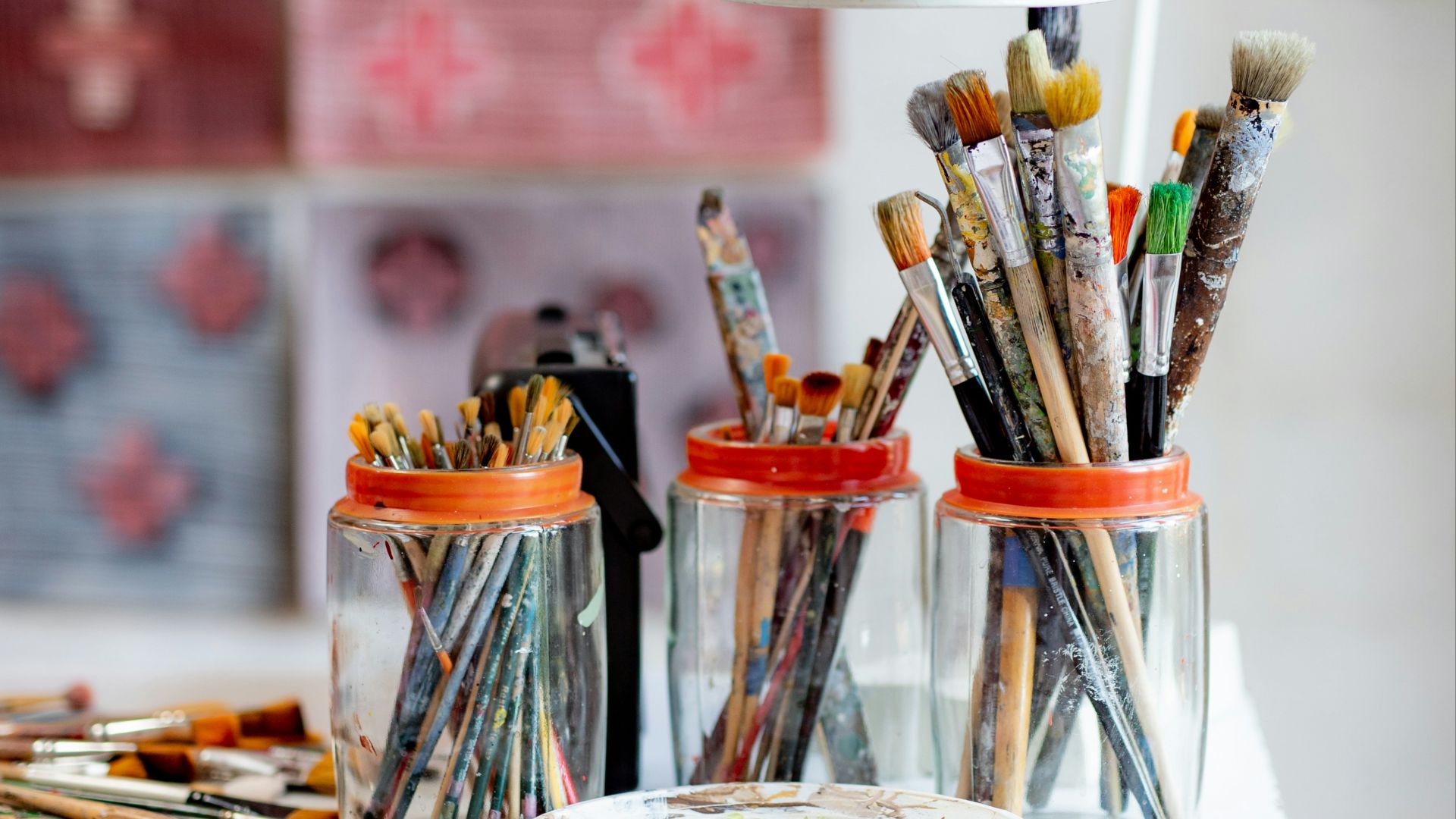 white ceramic plate with paint brushes and paint brushes