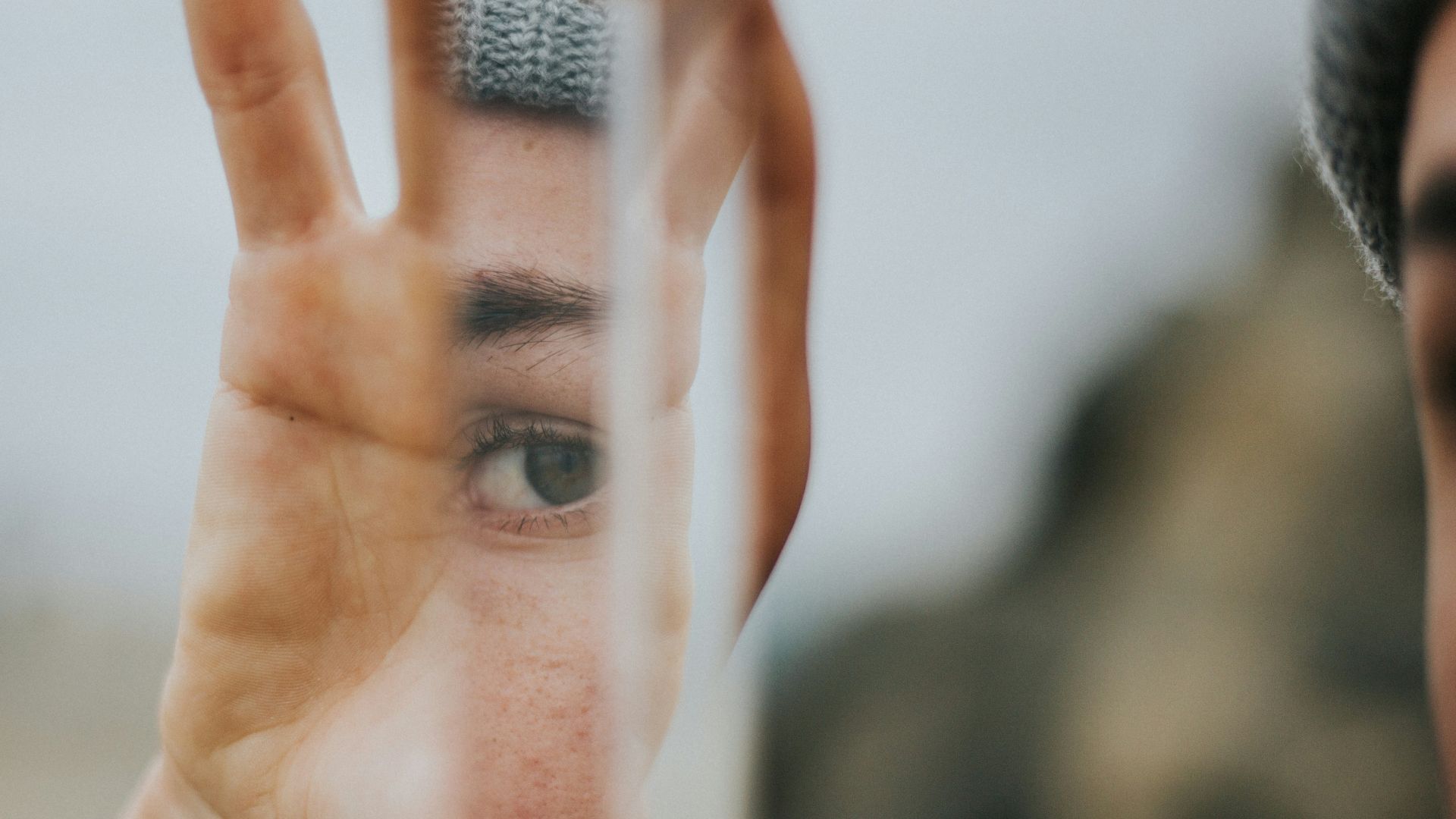 shallow focus of person holding mirror