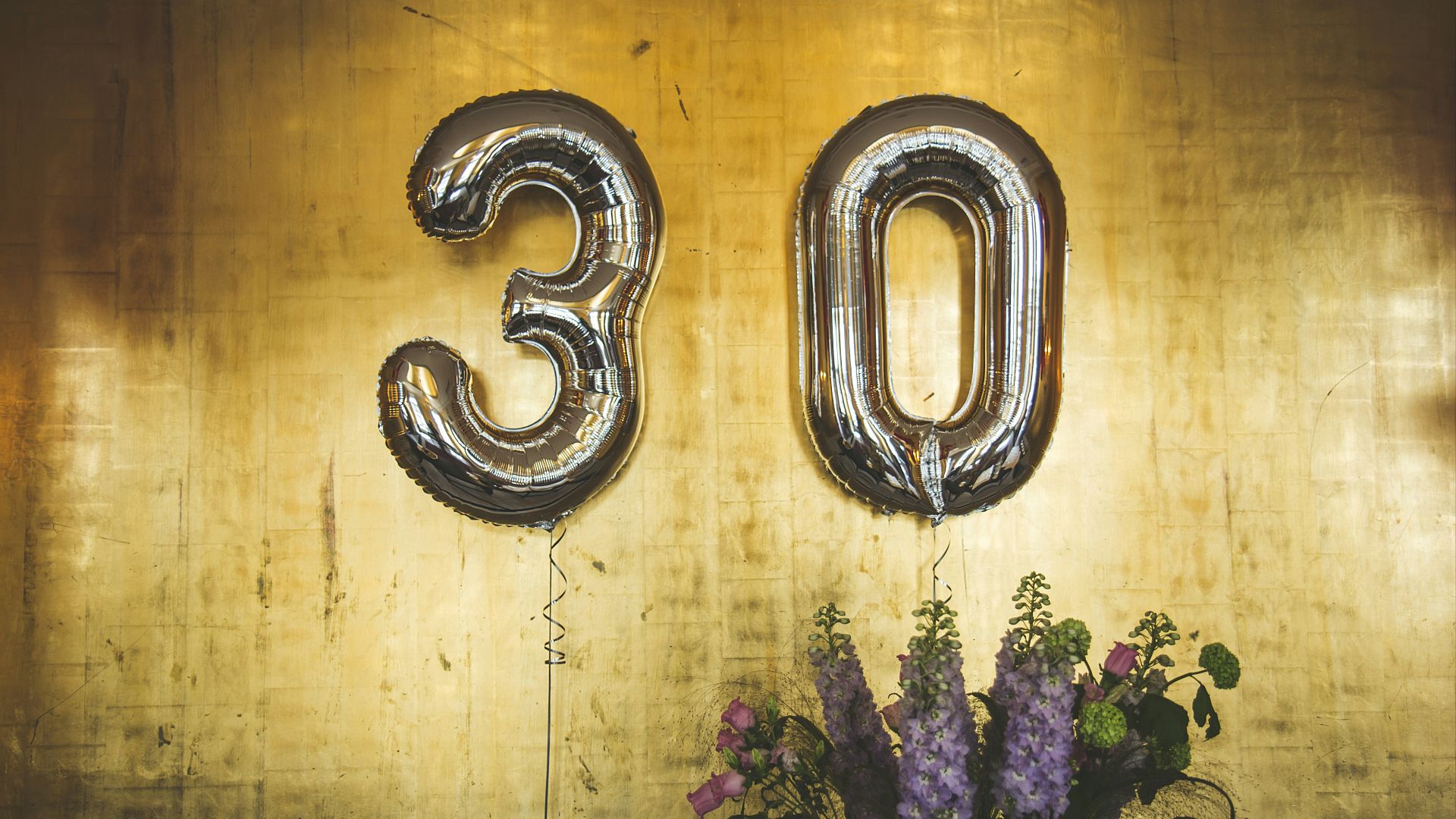 minimalist photography of hanged 30 balloons
