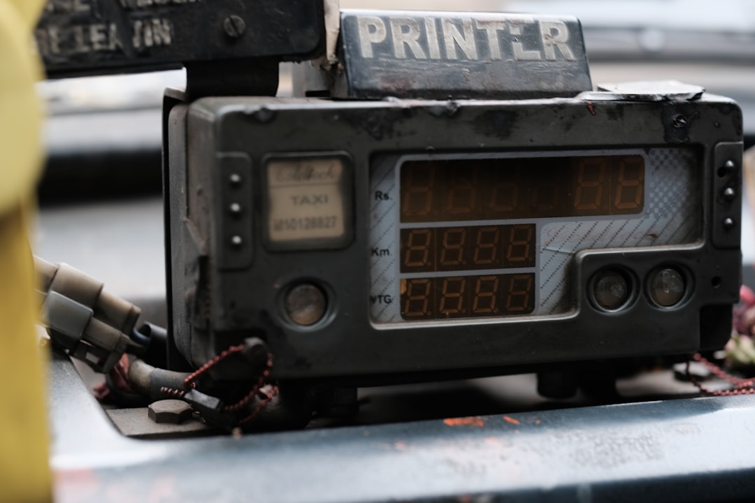 A radio sitting on top of a table next to a yellow fire hydrant