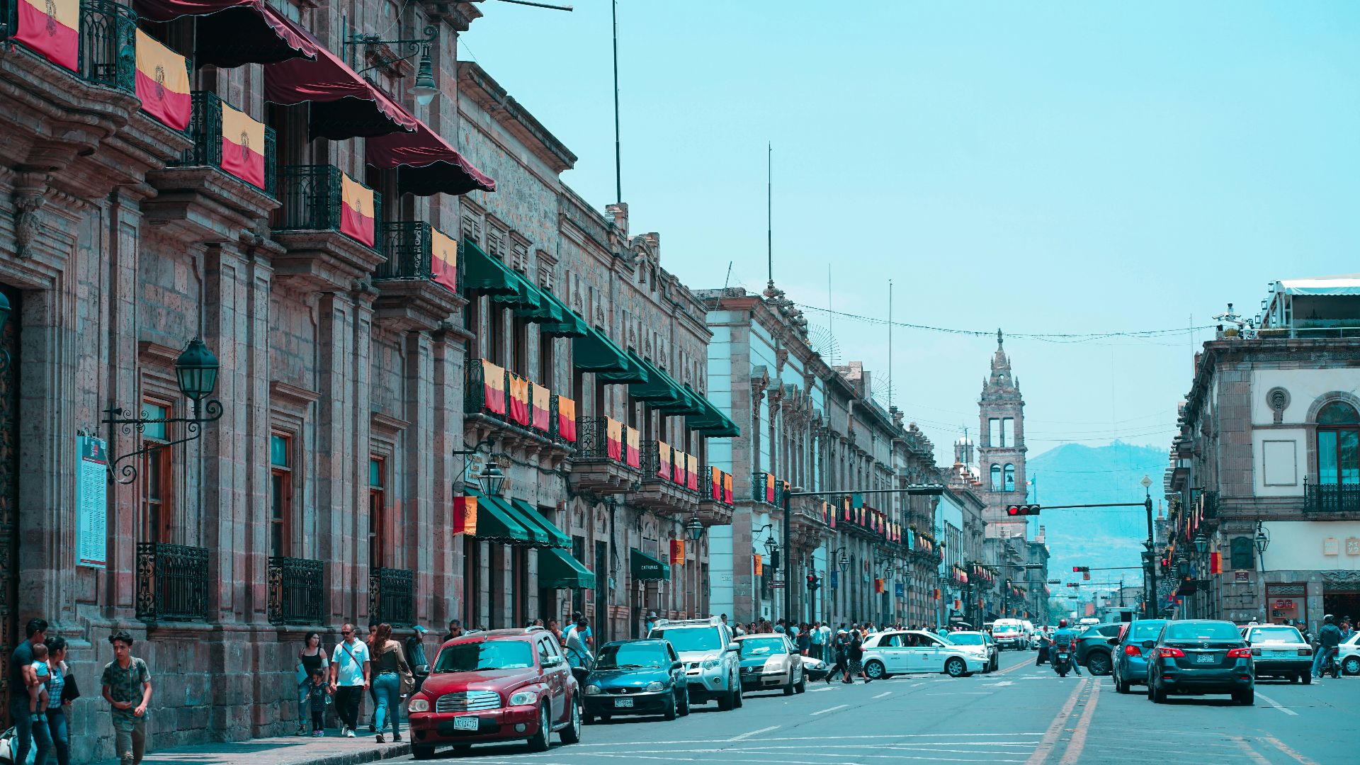 vehicles on road under white sky at daytime