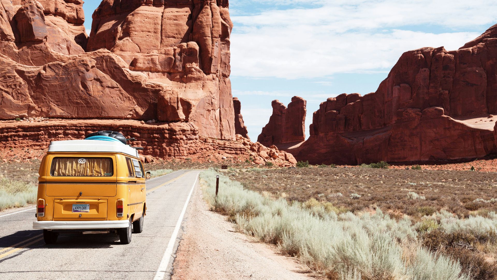 yellow Volkswagen van on road