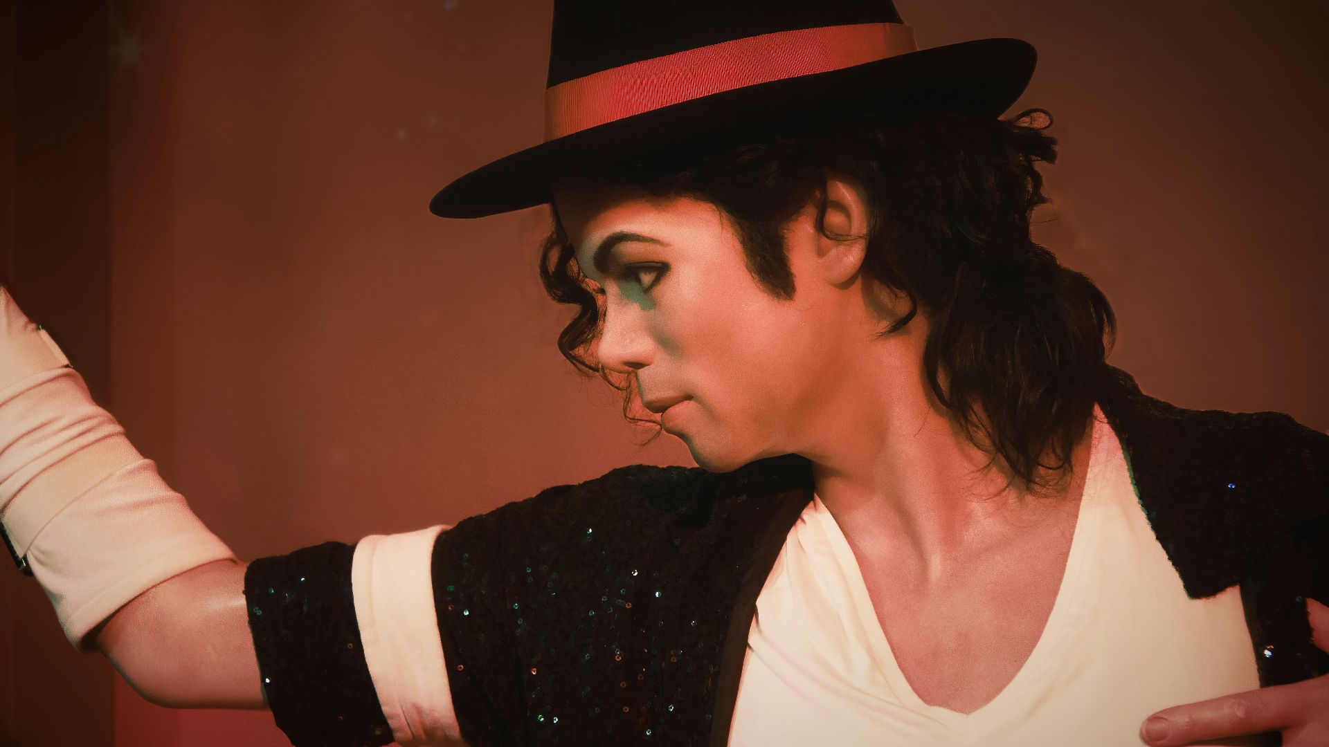 a man in a top hat and black jacket