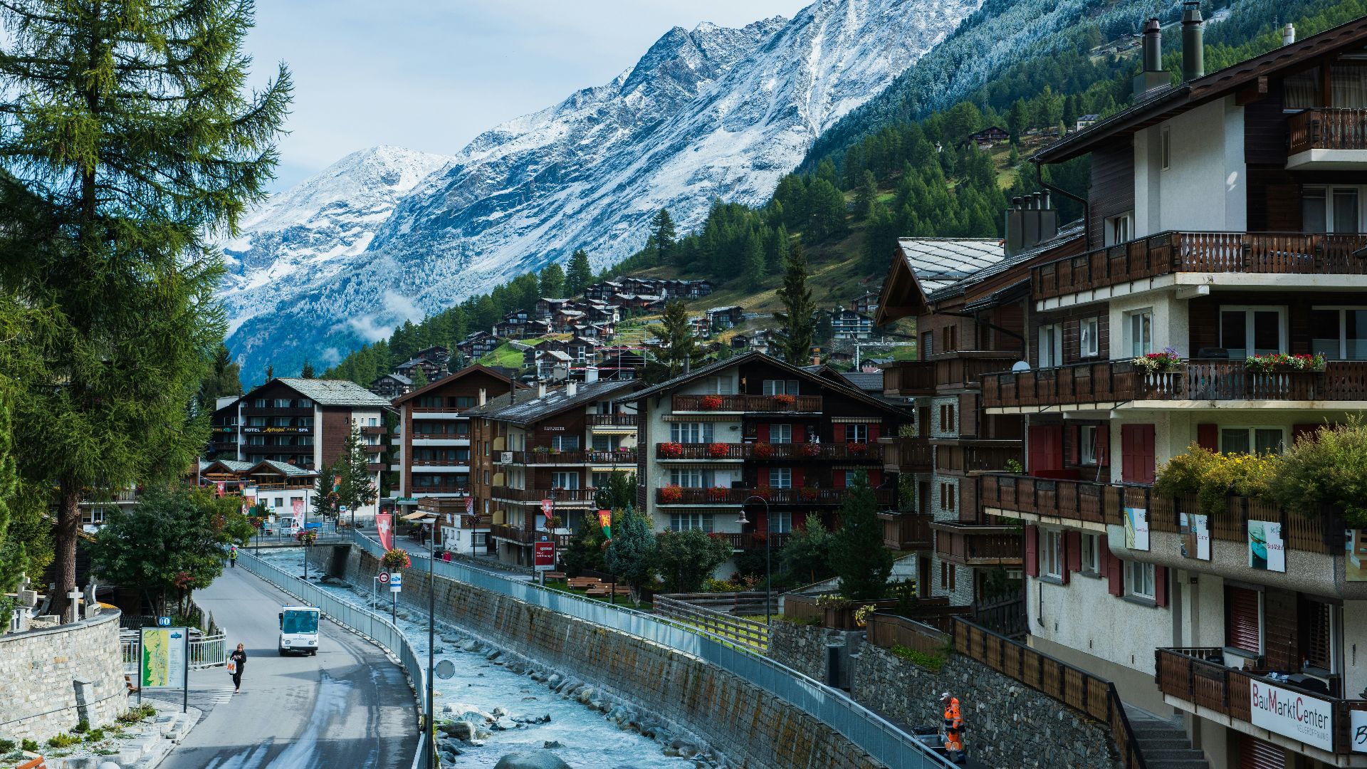 houses near road and mountain under blue sky during daytime photography