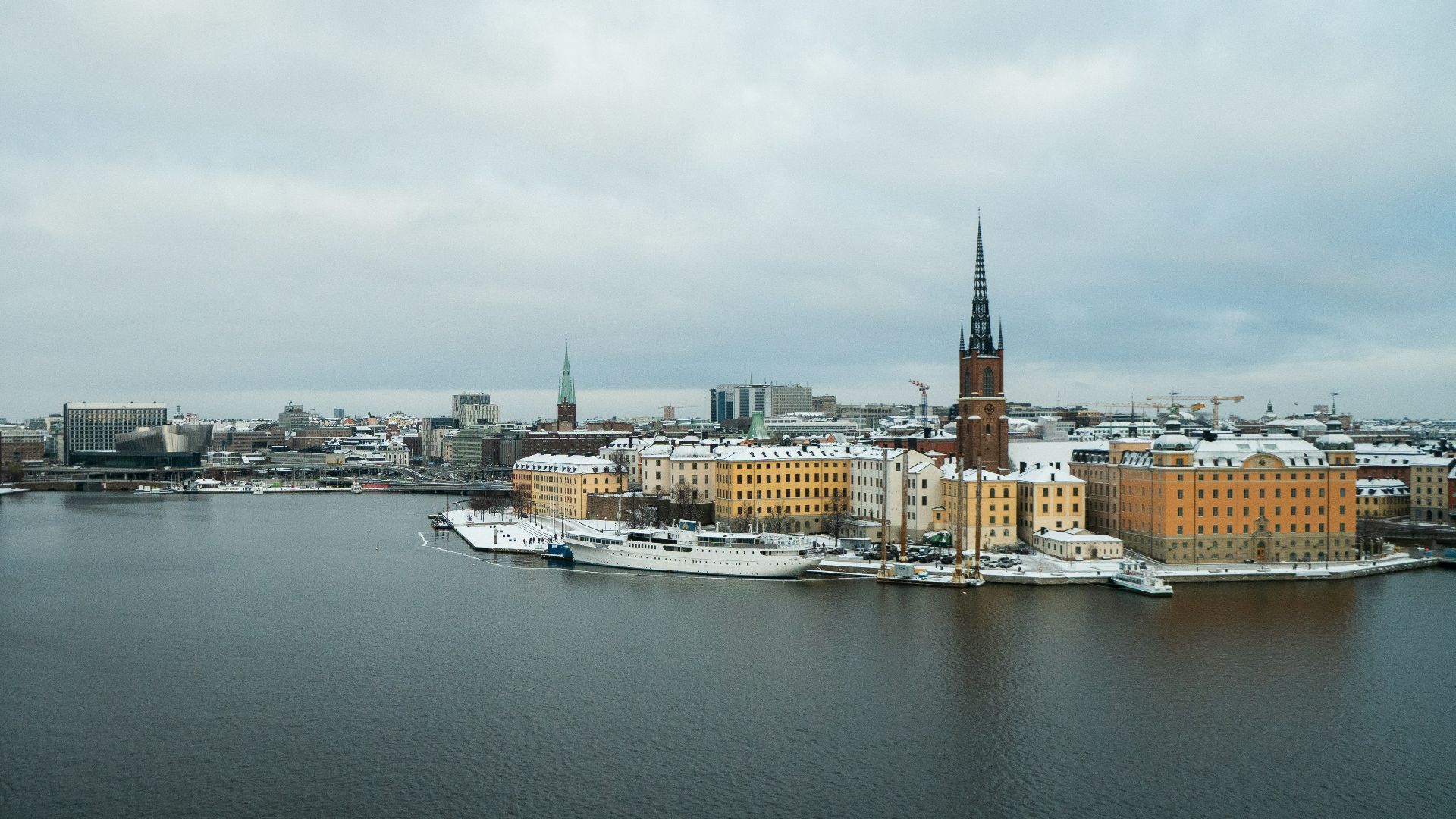 a large body of water with a city in the background