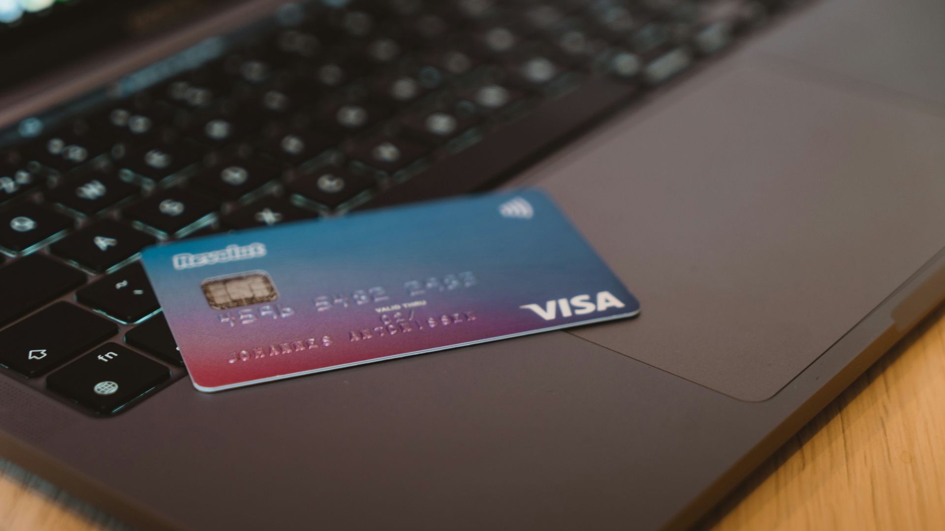 blue and white visa card on silver laptop computer
