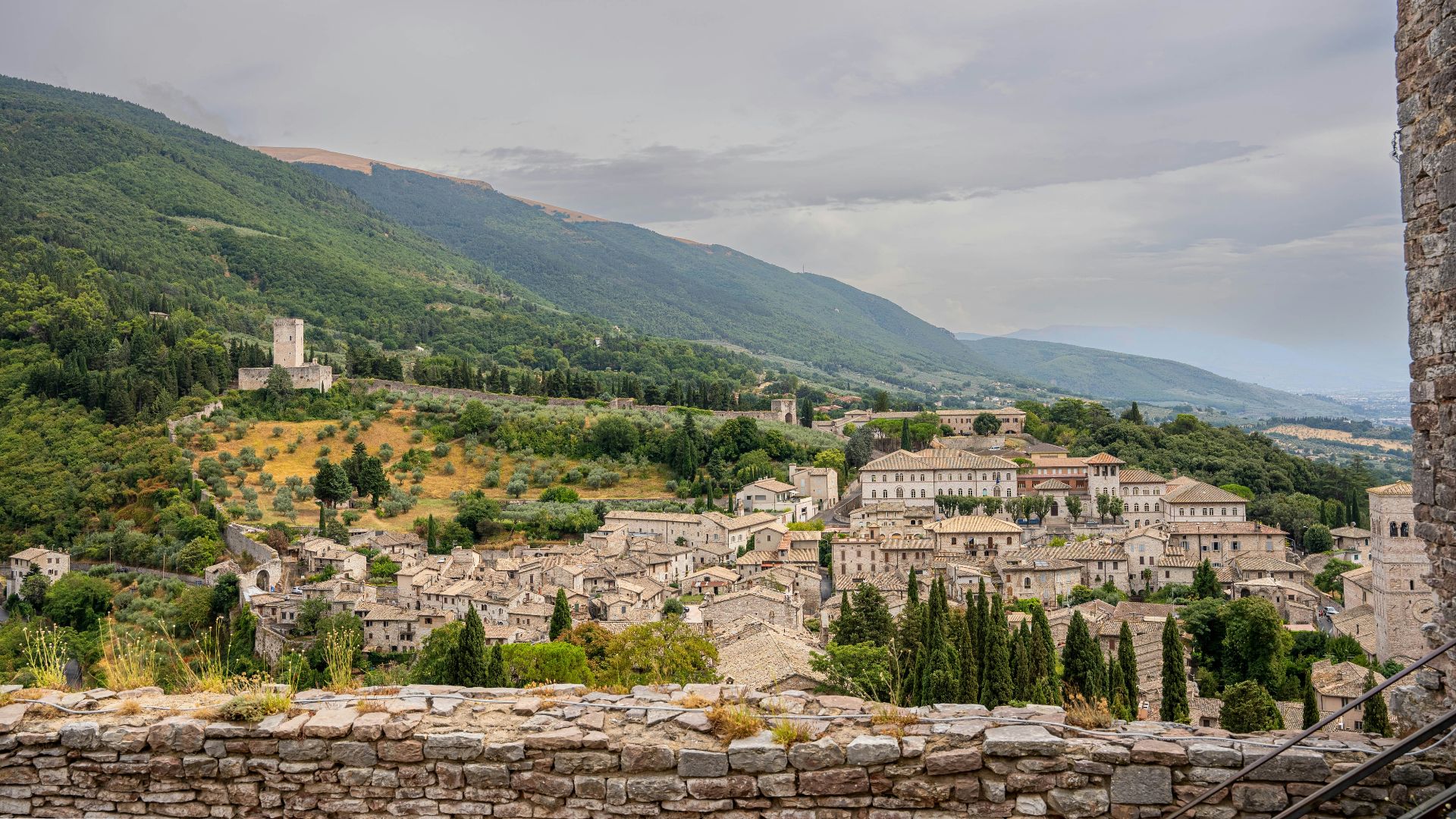 A scenic view of a village in the mountains