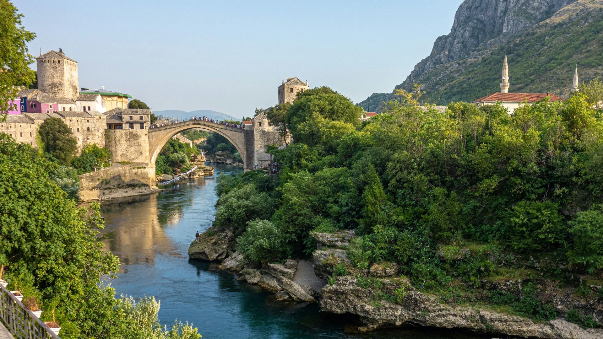 brown concrete bridge over river during daytime
