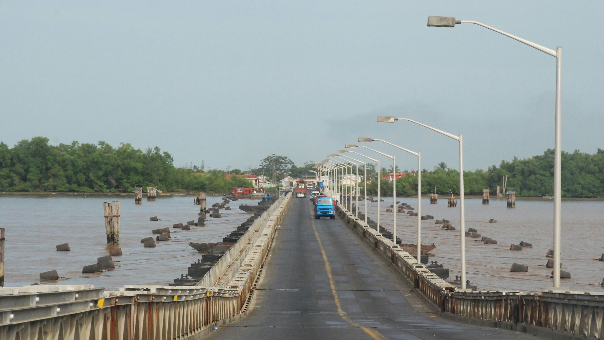 gray concrete bridge over river during daytime