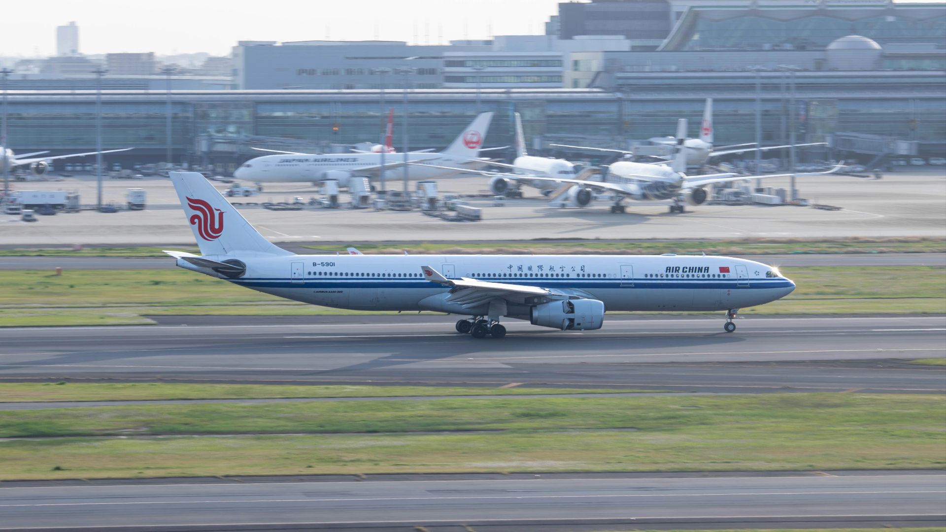 a large jetliner sitting on top of an airport runway