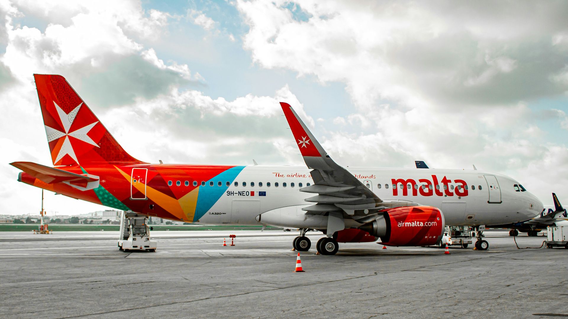 a large jetliner sitting on top of an airport tarmac